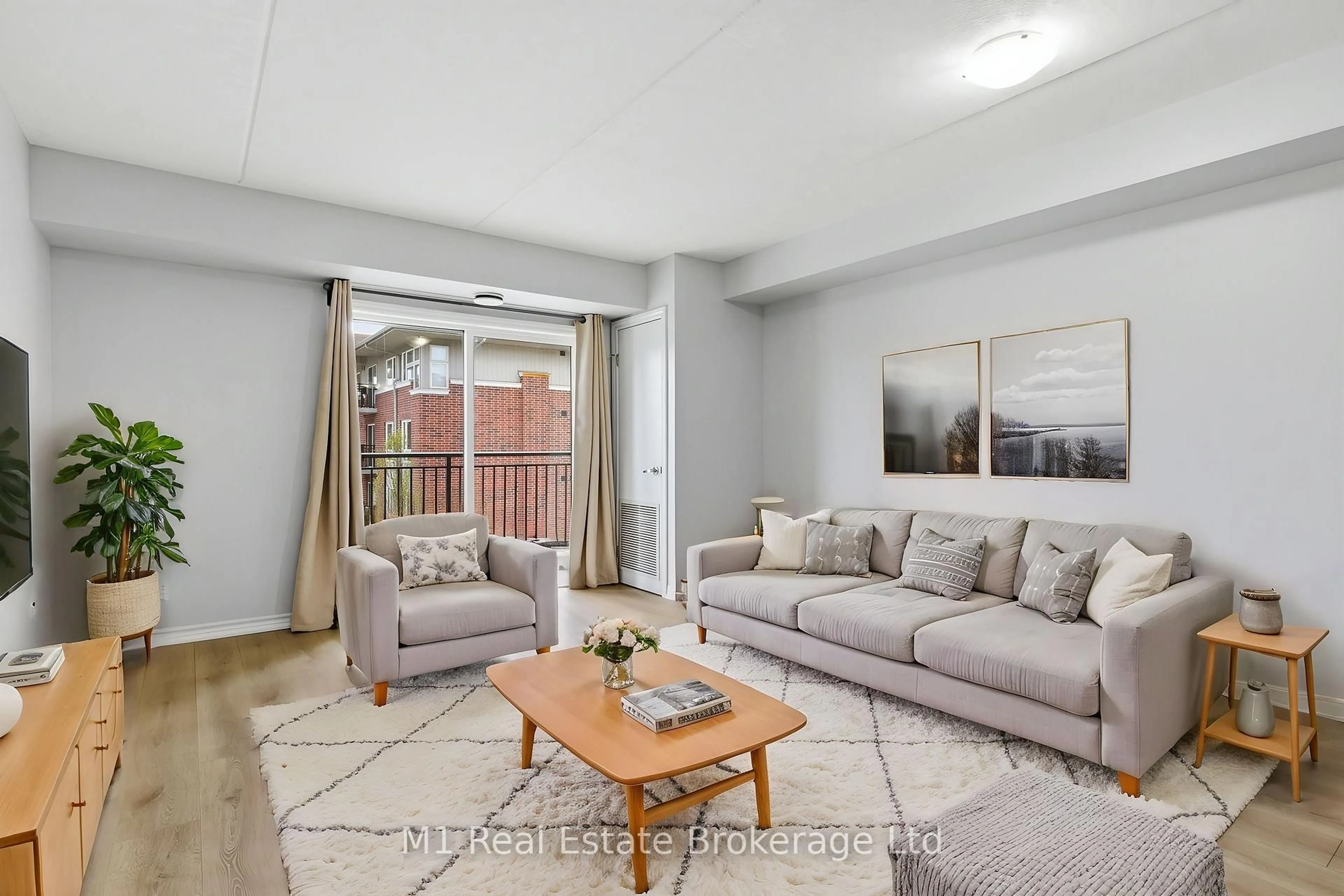 Living room with furniture, unknown for 45 Goodwin Dr #311, Guelph Ontario N1L 0E9