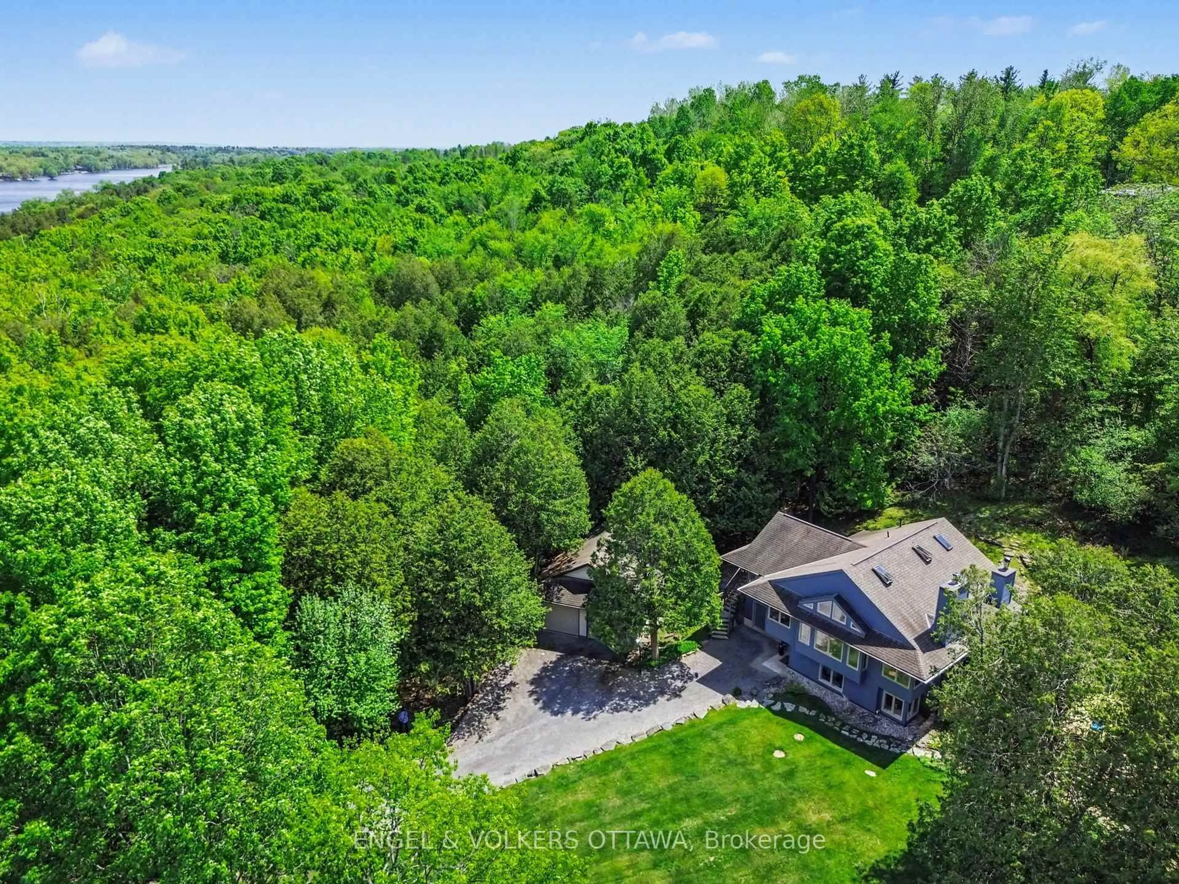 A pic from outside/outdoor area/front of a property/back of a property/a pic from drone, forest/trees view for 4637 Northwoods Dr, Ottawa Ontario K0A 3M0