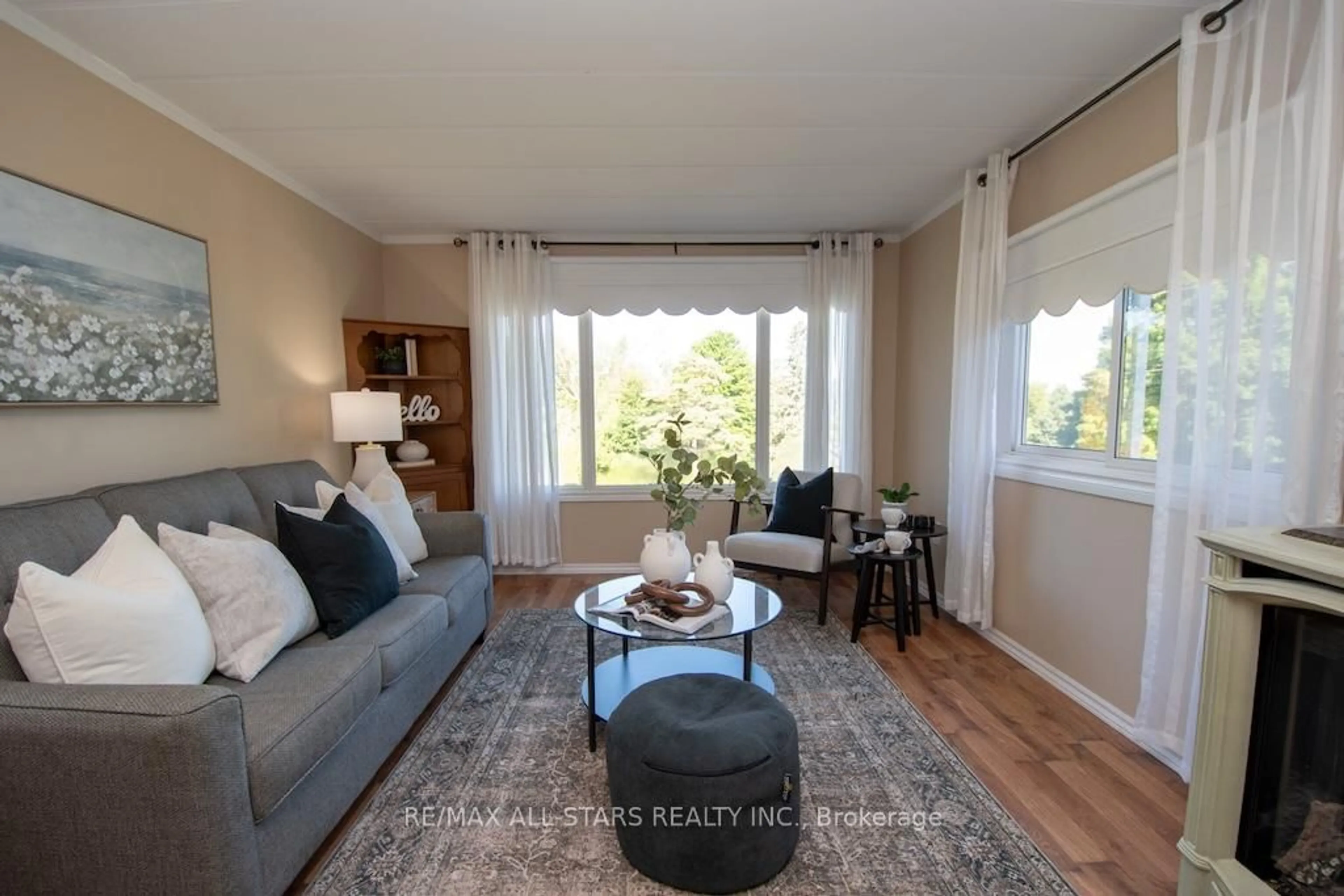 Living room with furniture, wood/laminate floor for 7 Marlene Dr, Kawartha Lakes Ontario L0A 1A0