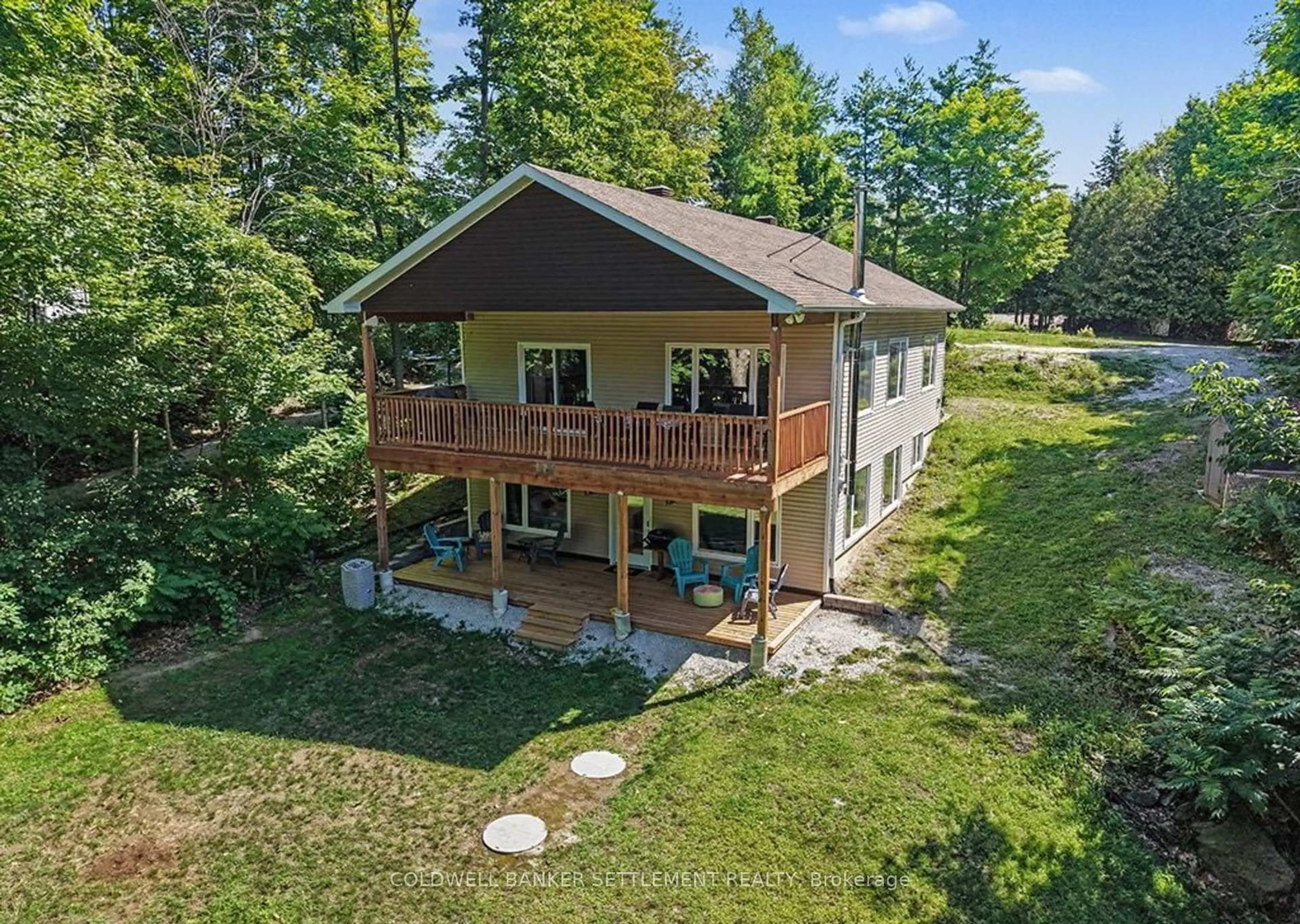 A pic from outside/outdoor area/front of a property/back of a property/a pic from drone, water/lake/river/ocean view for 234 Mica Point Lane, Maberly Ontario K0H 2B0