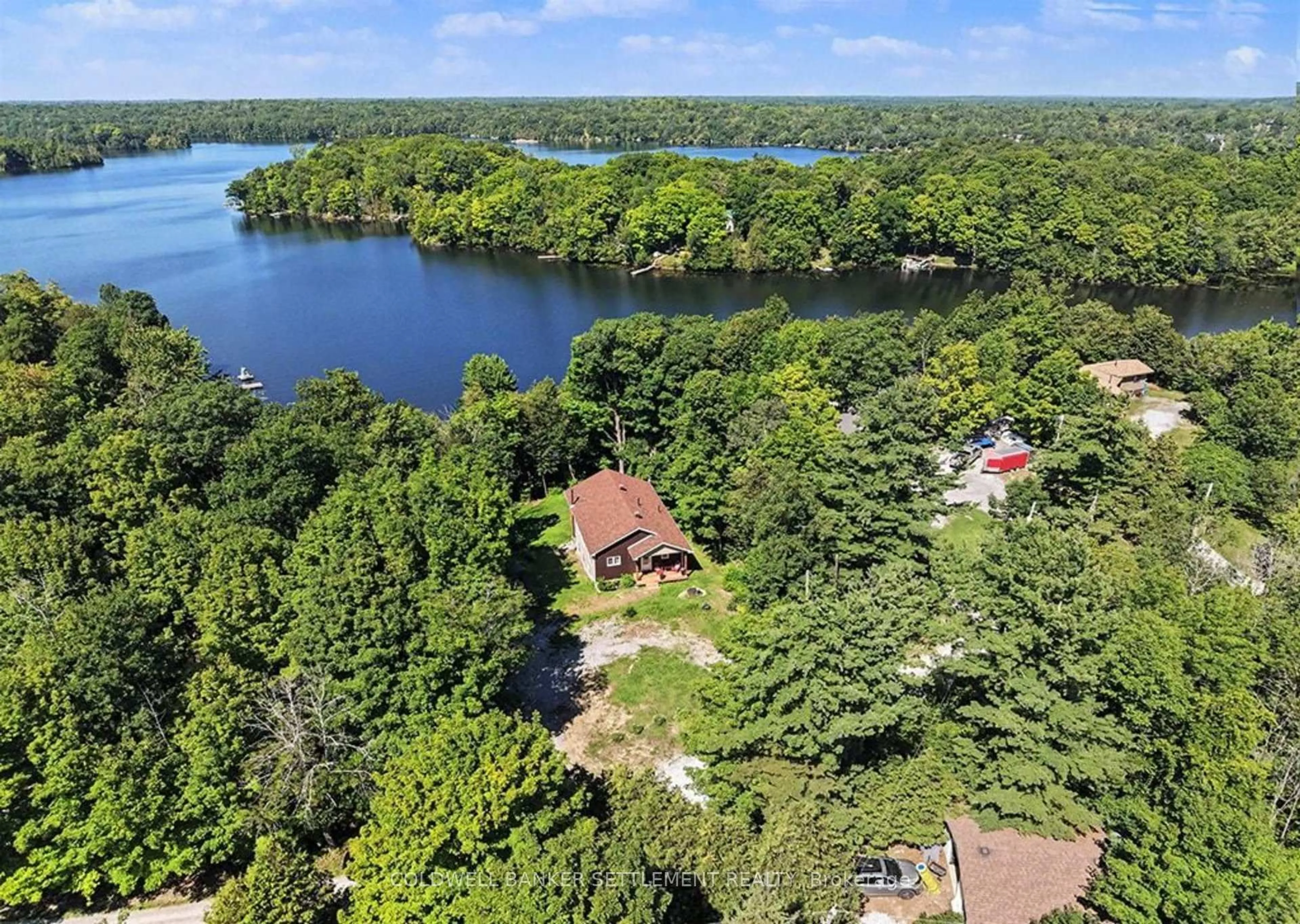 A pic from outside/outdoor area/front of a property/back of a property/a pic from drone, water/lake/river/ocean view for 234 Mica Point Lane, Maberly Ontario K0H 2B0