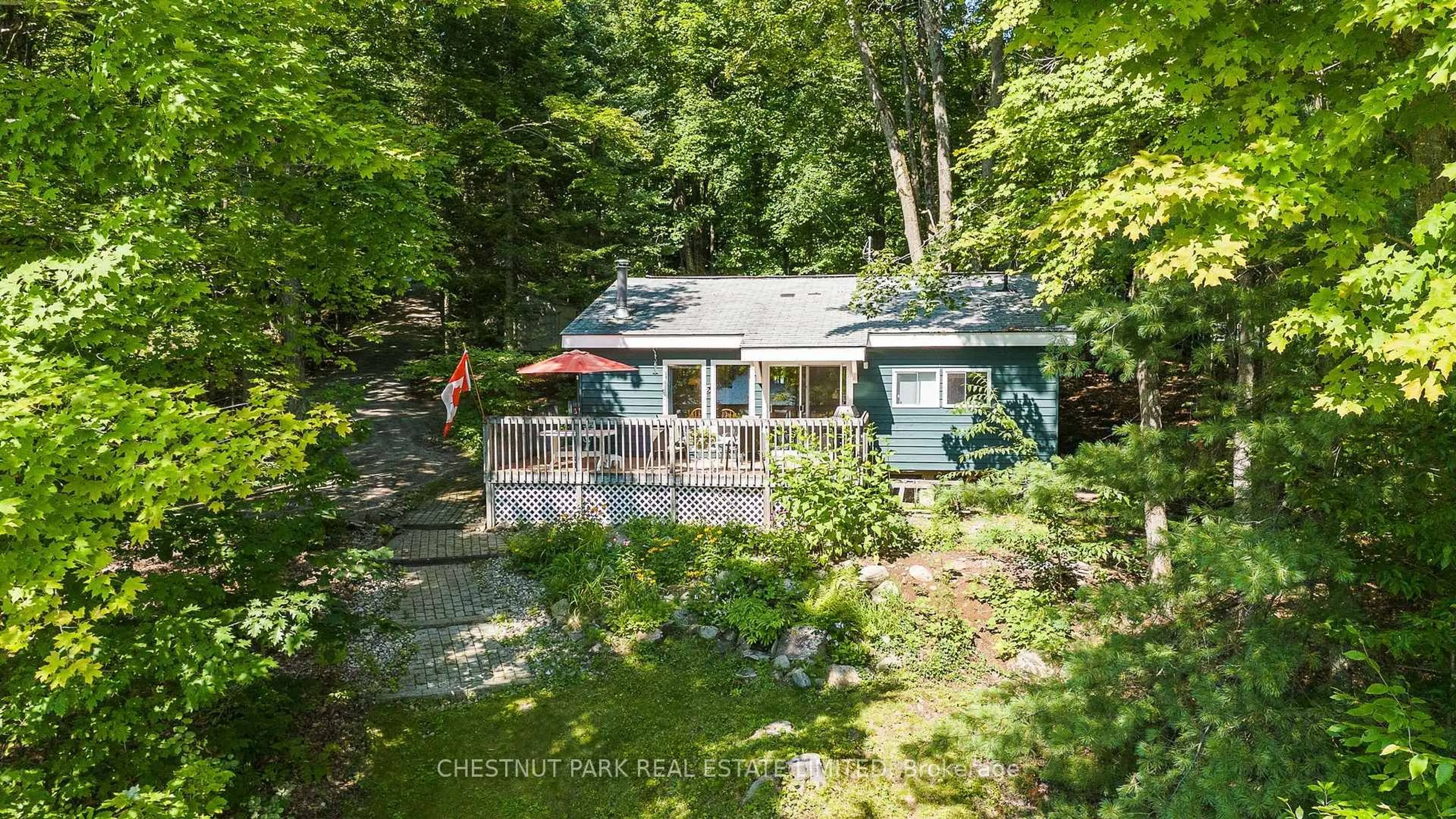 A pic from outside/outdoor area/front of a property/back of a property/a pic from drone, water/lake/river/ocean view for 1184 Little Bob Lake Rd, Minden Hills Ontario K0M 2S0