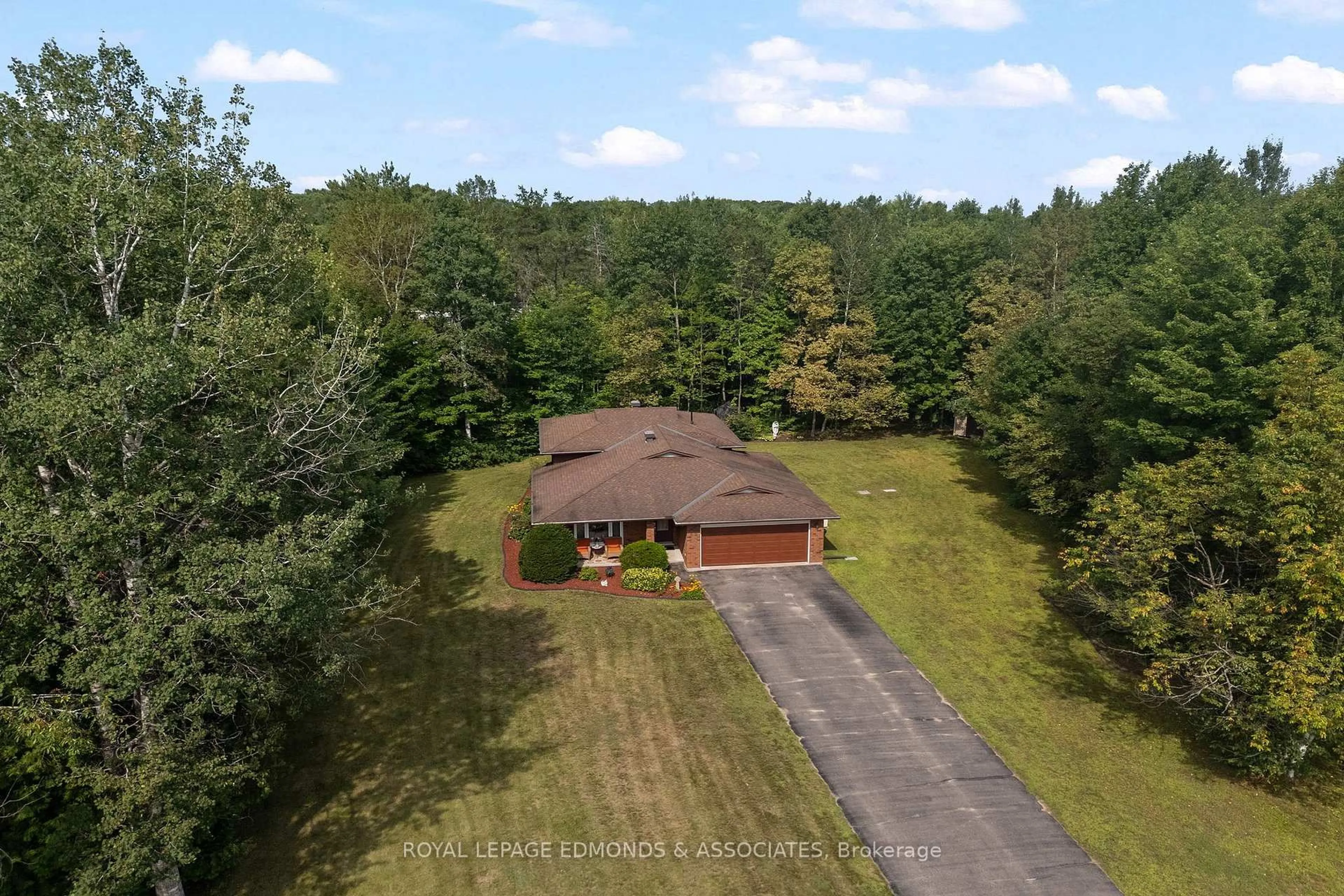 A pic from outside/outdoor area/front of a property/back of a property/a pic from drone, forest/trees view for 20 Mueller Cres, Petawawa Ontario K8H 3E9