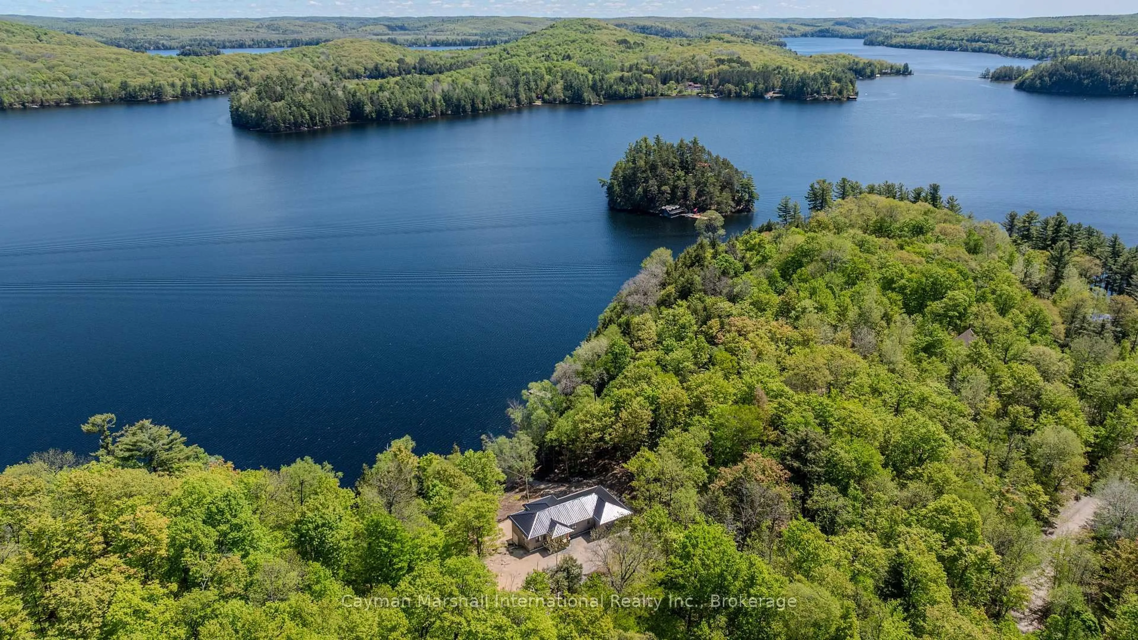 A pic from outside/outdoor area/front of a property/back of a property/a pic from drone, water/lake/river/ocean view for 1151 Elder Rd #2, Lake of Bays Ontario P0A 1H0