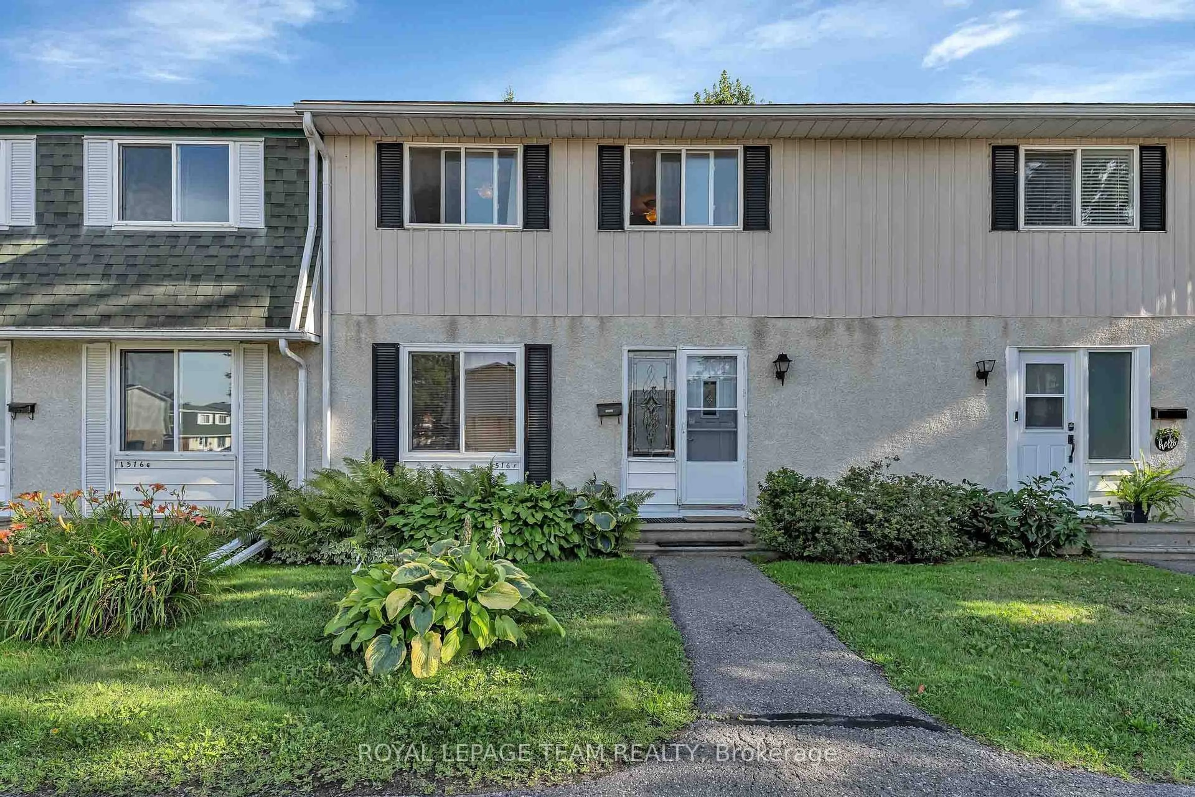 Home with vinyl exterior material, street for 1516 Beaverpond Dr #F, Ottawa Ontario K1B 3R9