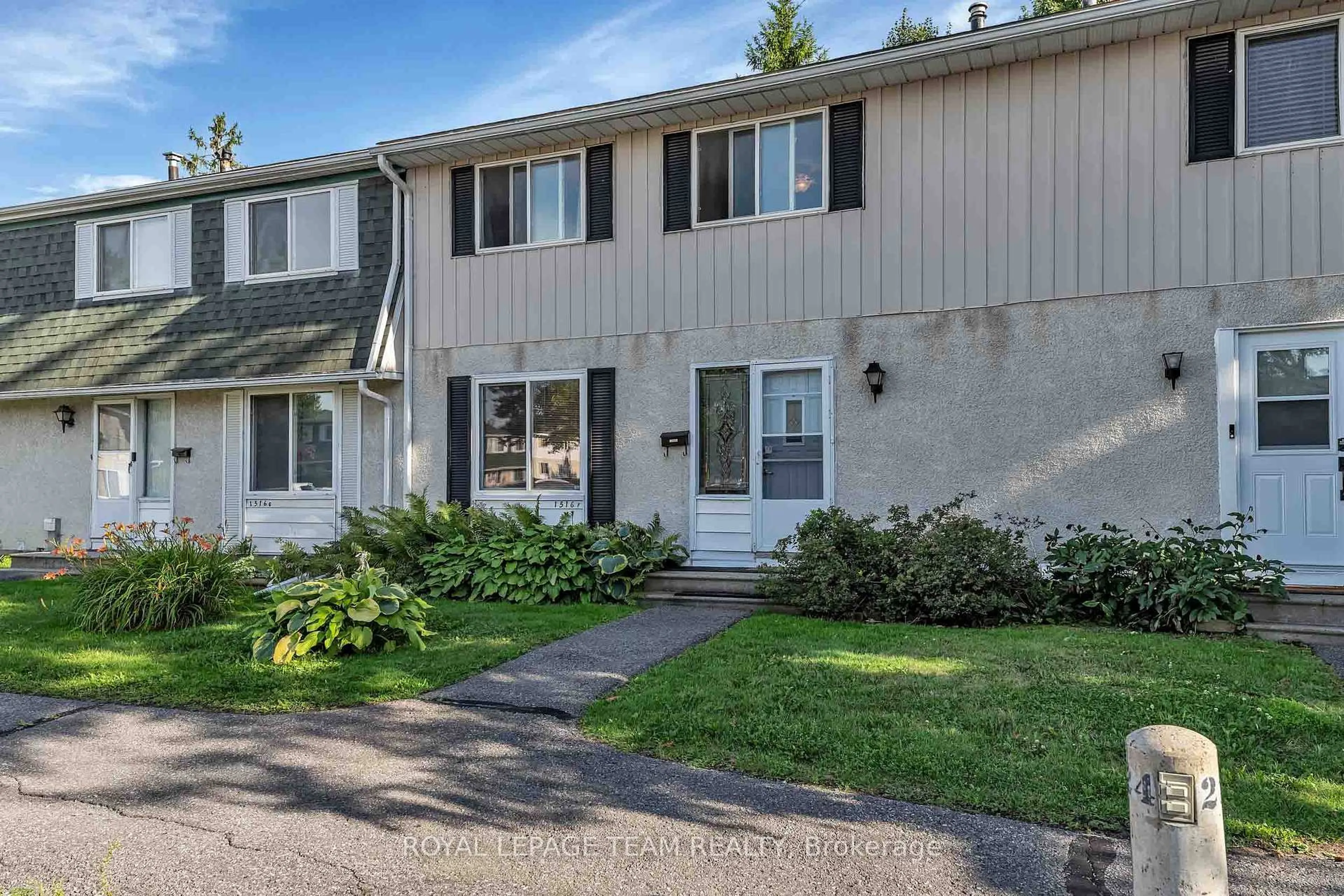 Home with vinyl exterior material, street for 1516 Beaverpond Dr #F, Ottawa Ontario K1B 3R9