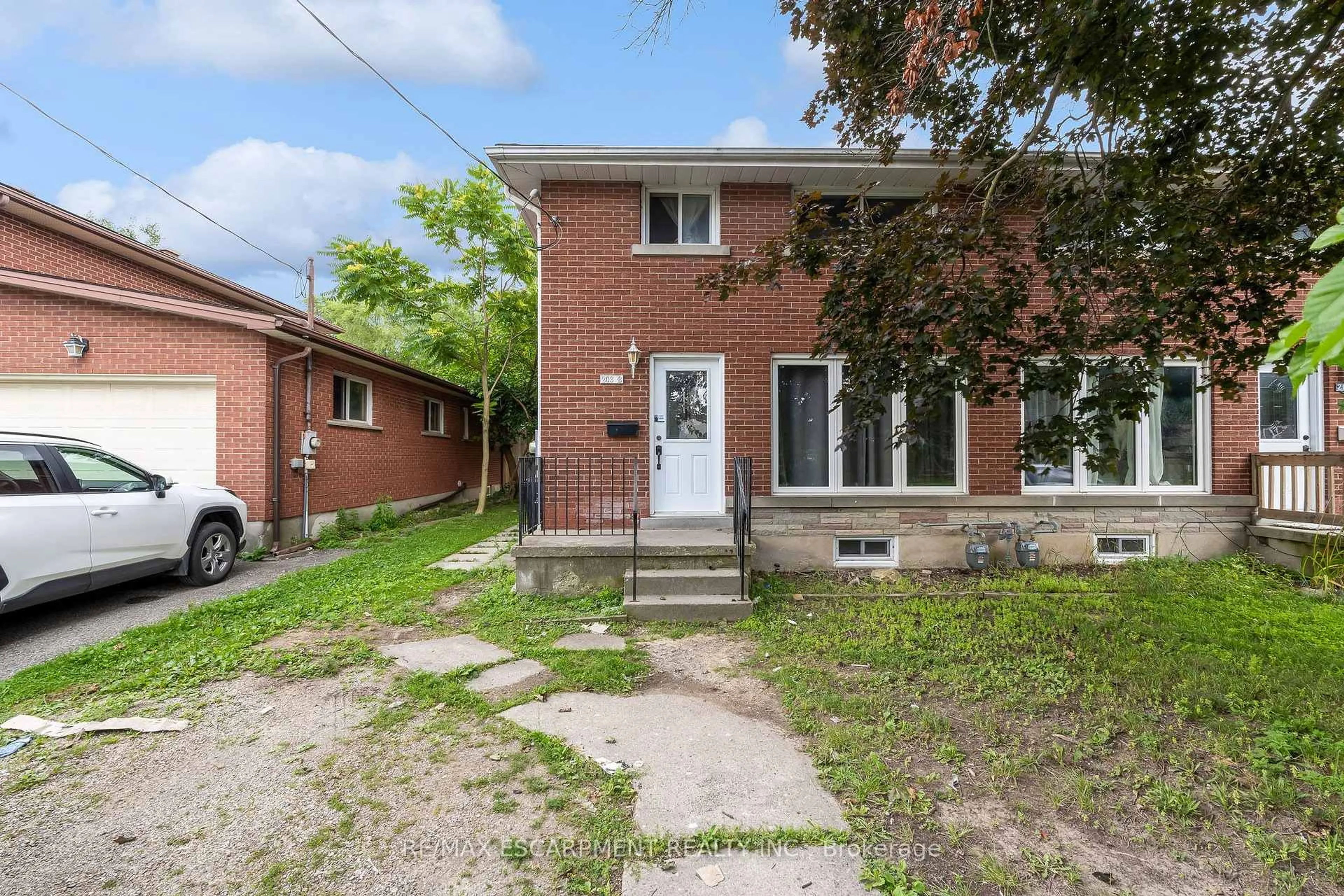 Home with brick exterior material, street for 203B Erb St, Waterloo Ontario N2J 1M7