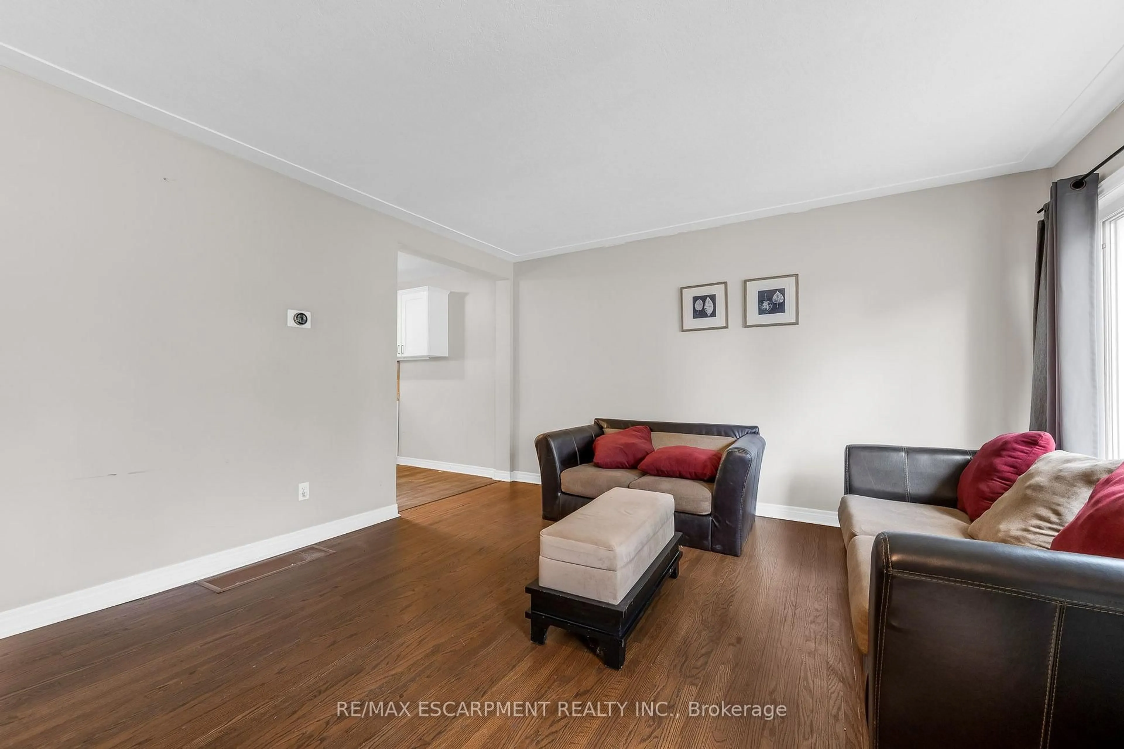 Living room with furniture, wood/laminate floor for 203B Erb St, Waterloo Ontario N2J 1M7