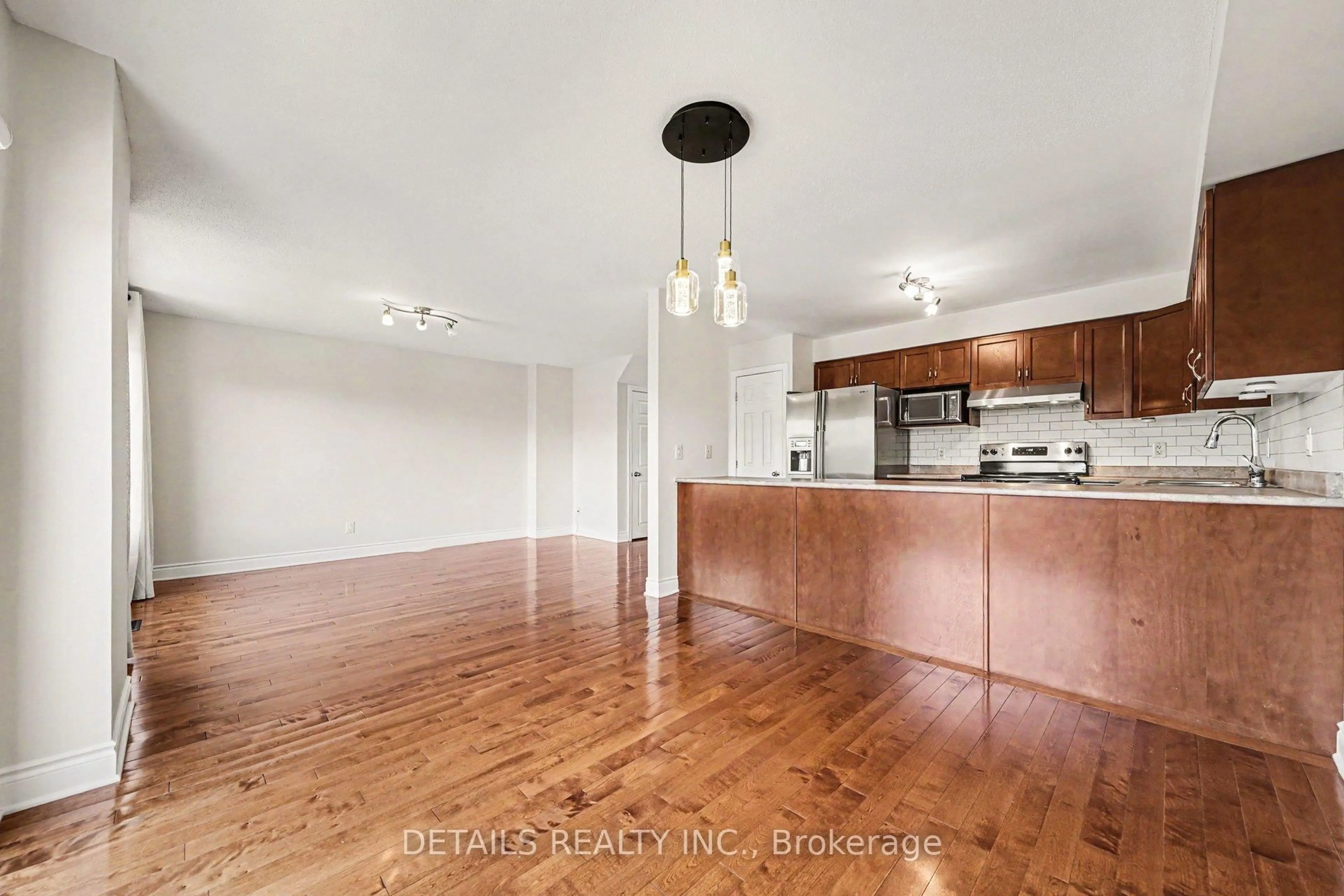 Open concept kitchen, wood/laminate floor for 261 Parkin Circ, Ottawa Ontario K1T 4G8
