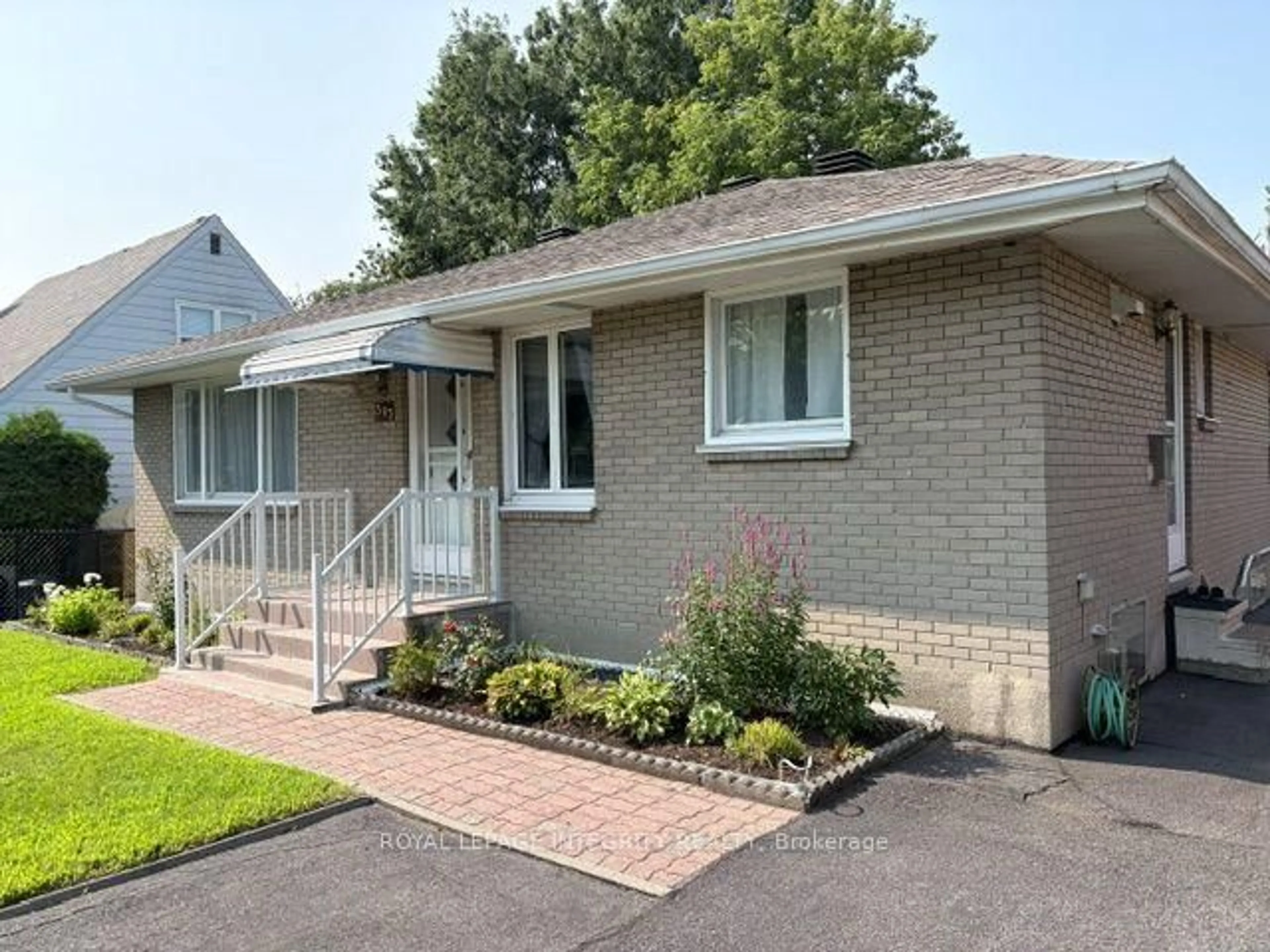 Home with brick exterior material, street for 393 Spartan Ave, Ottawa Ontario K1K 1J6