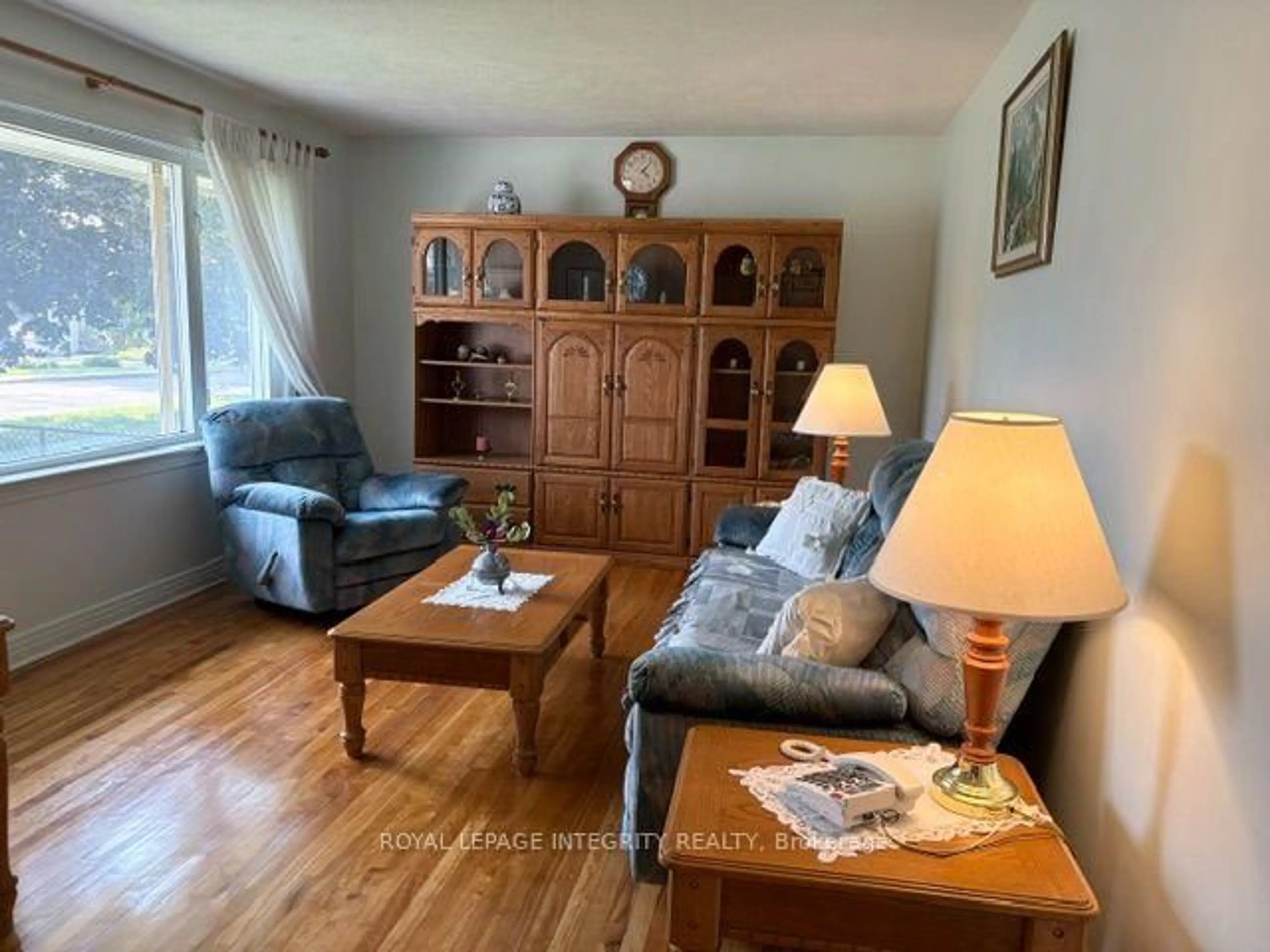 Living room with furniture, wood/laminate floor for 393 Spartan Ave, Ottawa Ontario K1K 1J6