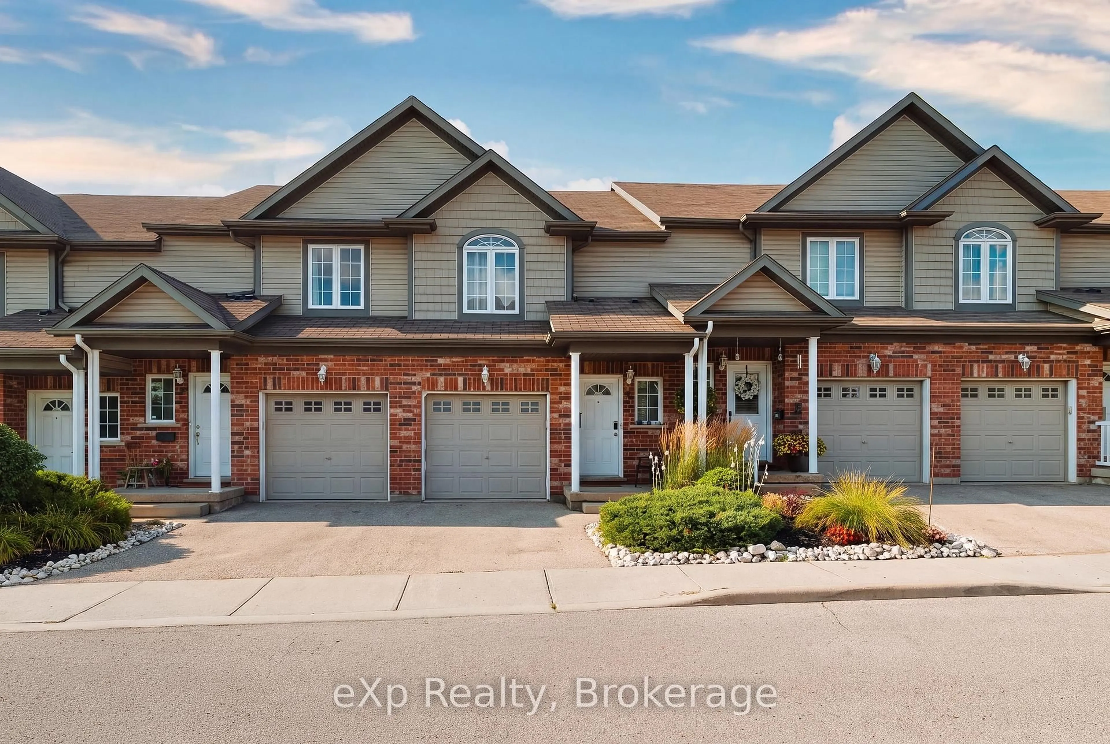 Home with brick exterior material, street for 975 Strasburg Rd #4, Kitchener Ontario N2E 0A8