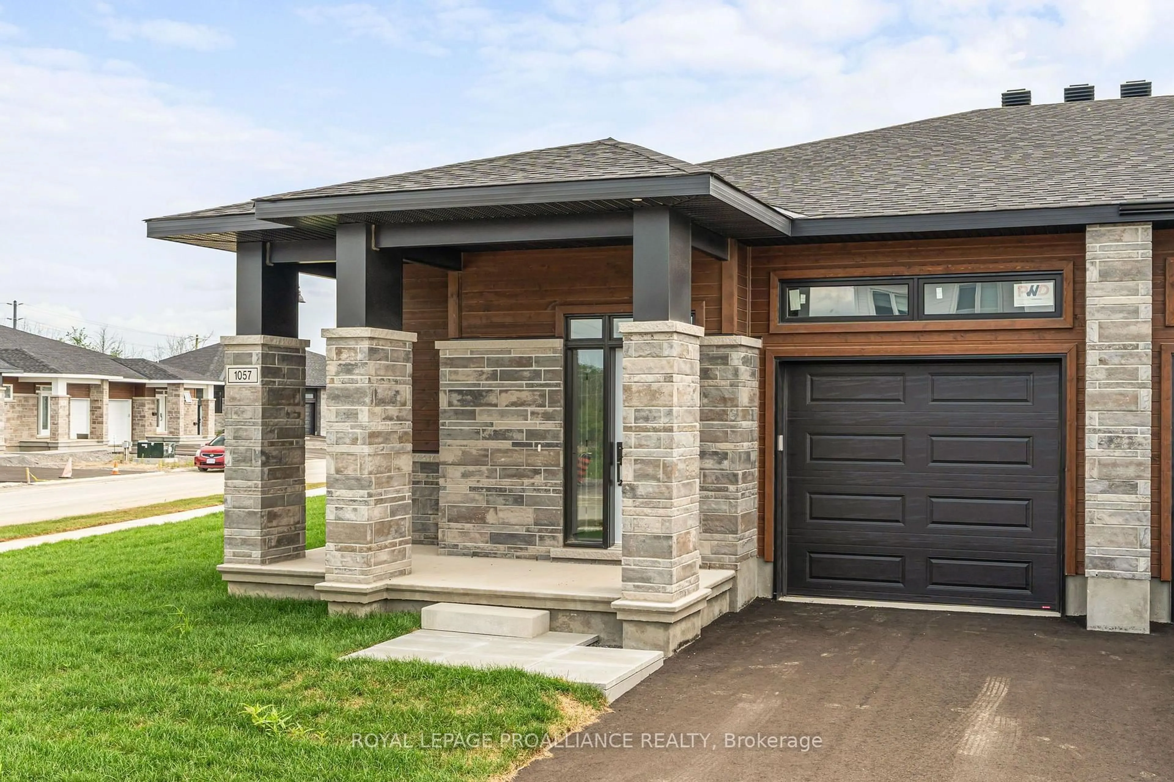 Home with brick exterior material, street for 1057 Moore St, Brockville Ontario K6V 0H1