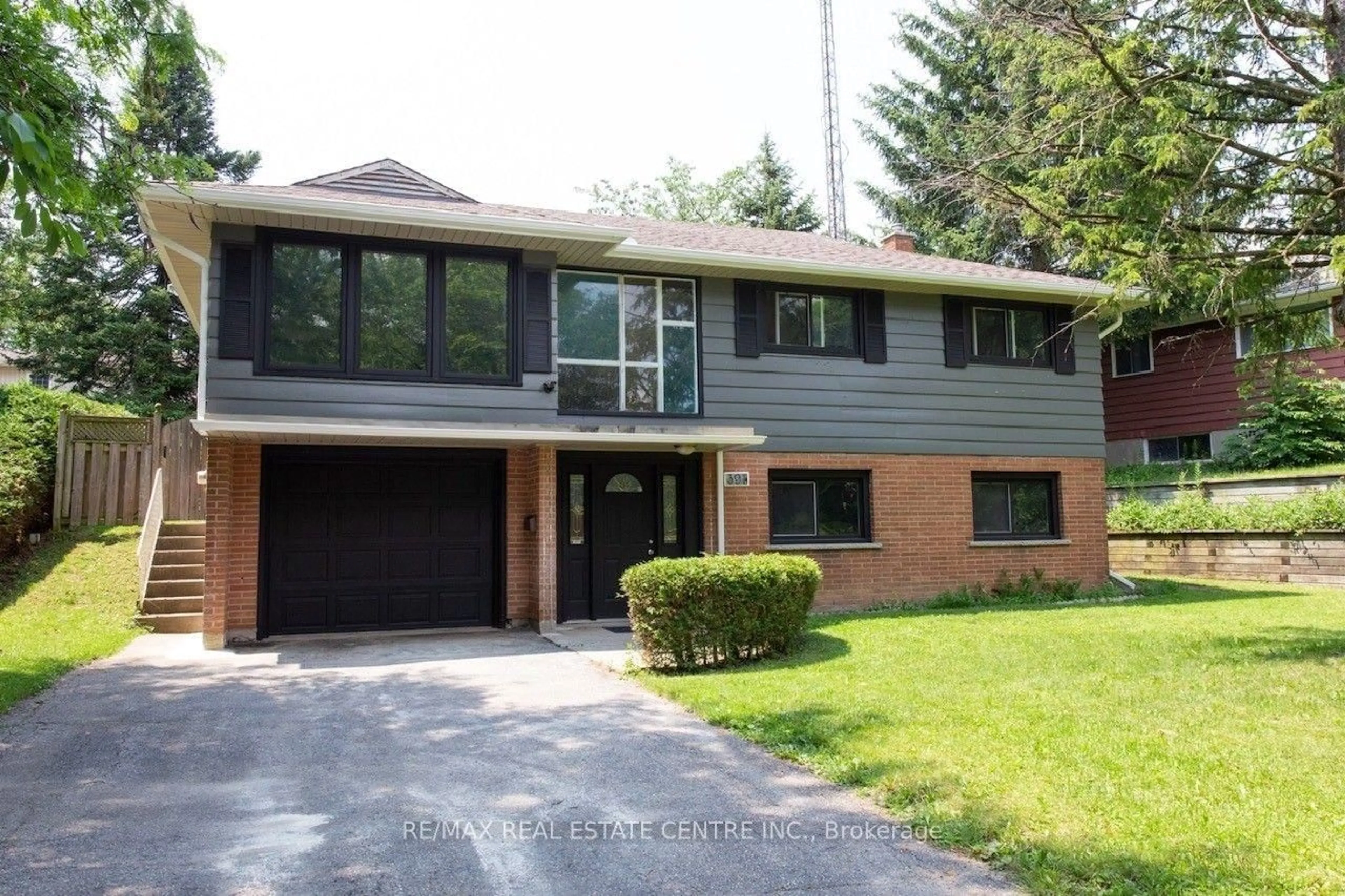 Home with brick exterior material, street for 391 Tamarack Dr, Waterloo Ontario N2L 4G7