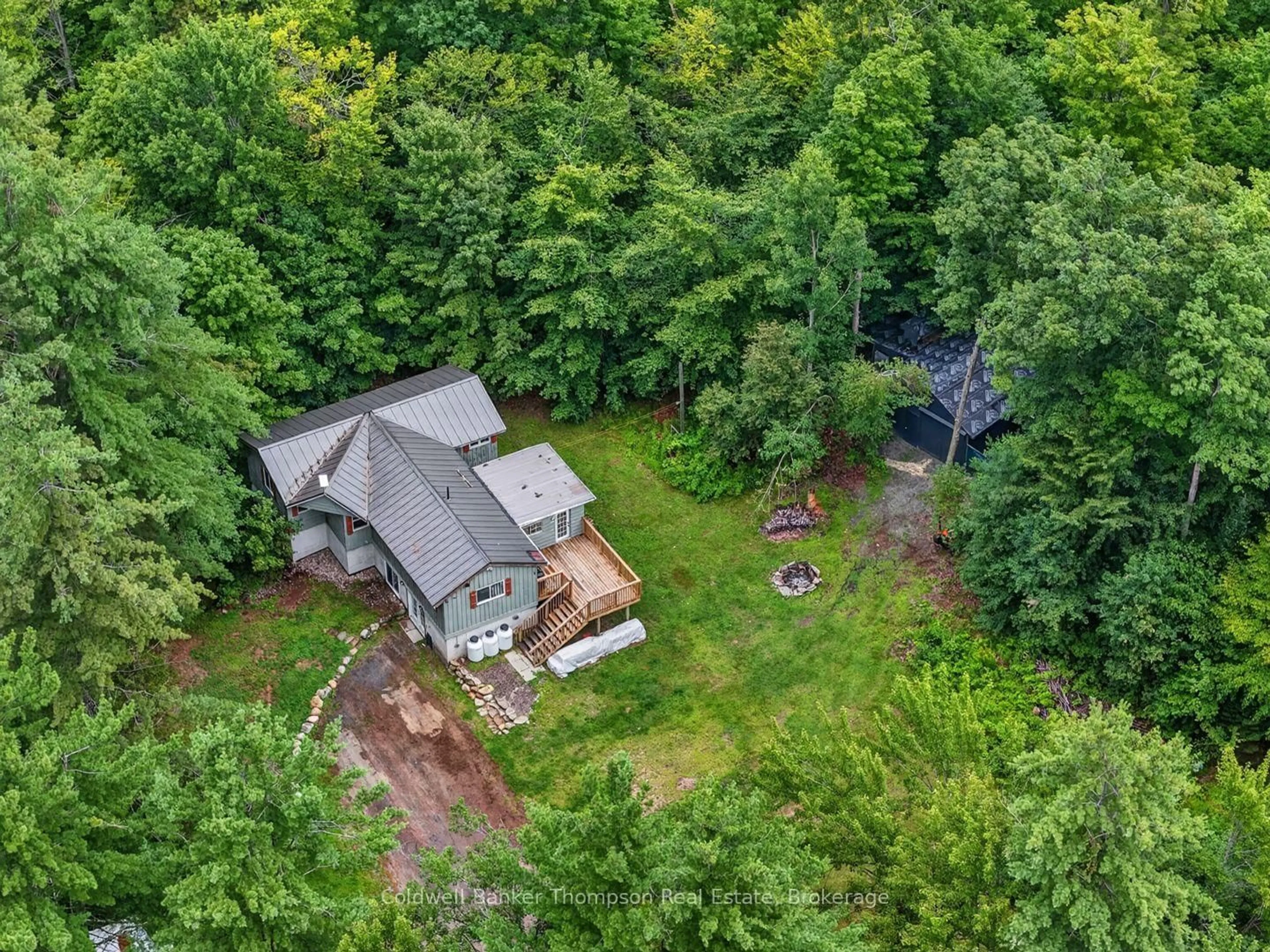 A pic from outside/outdoor area/front of a property/back of a property/a pic from drone, forest/trees view for 1018 Ashley Lane, Bracebridge Ontario P1L 1X1