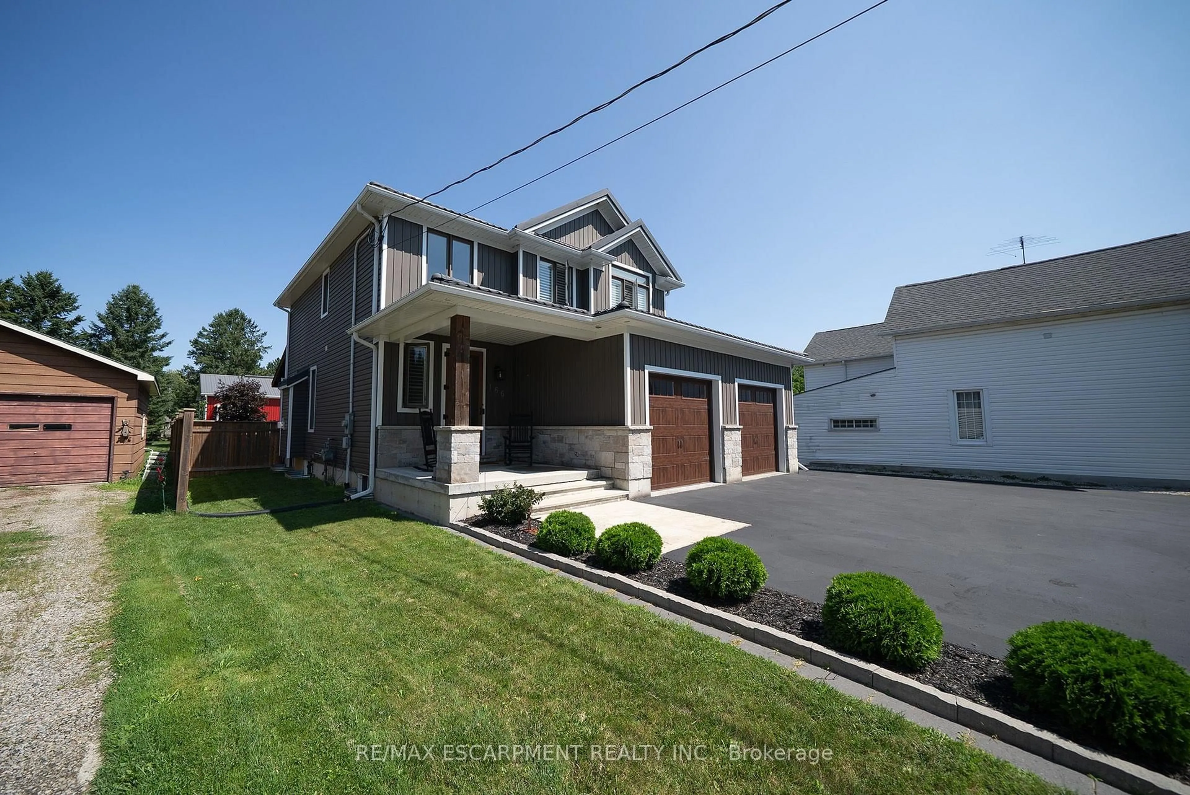 Home with vinyl exterior material, street for 166 King St, Brant Ontario N0E 1A0