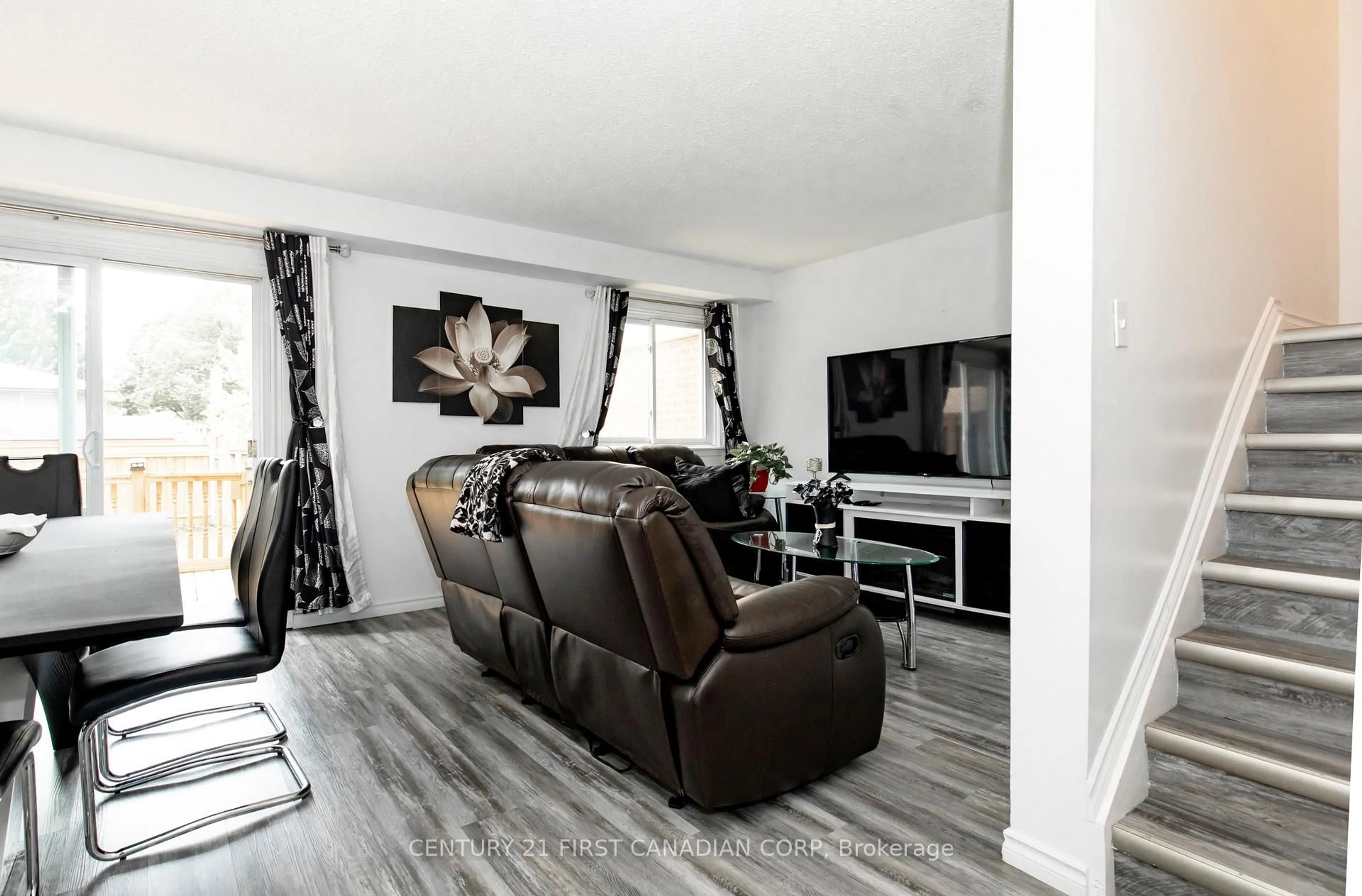 Living room with furniture, wood/laminate floor for 971 Adelaide St #48, London South Ontario N6E 2H3