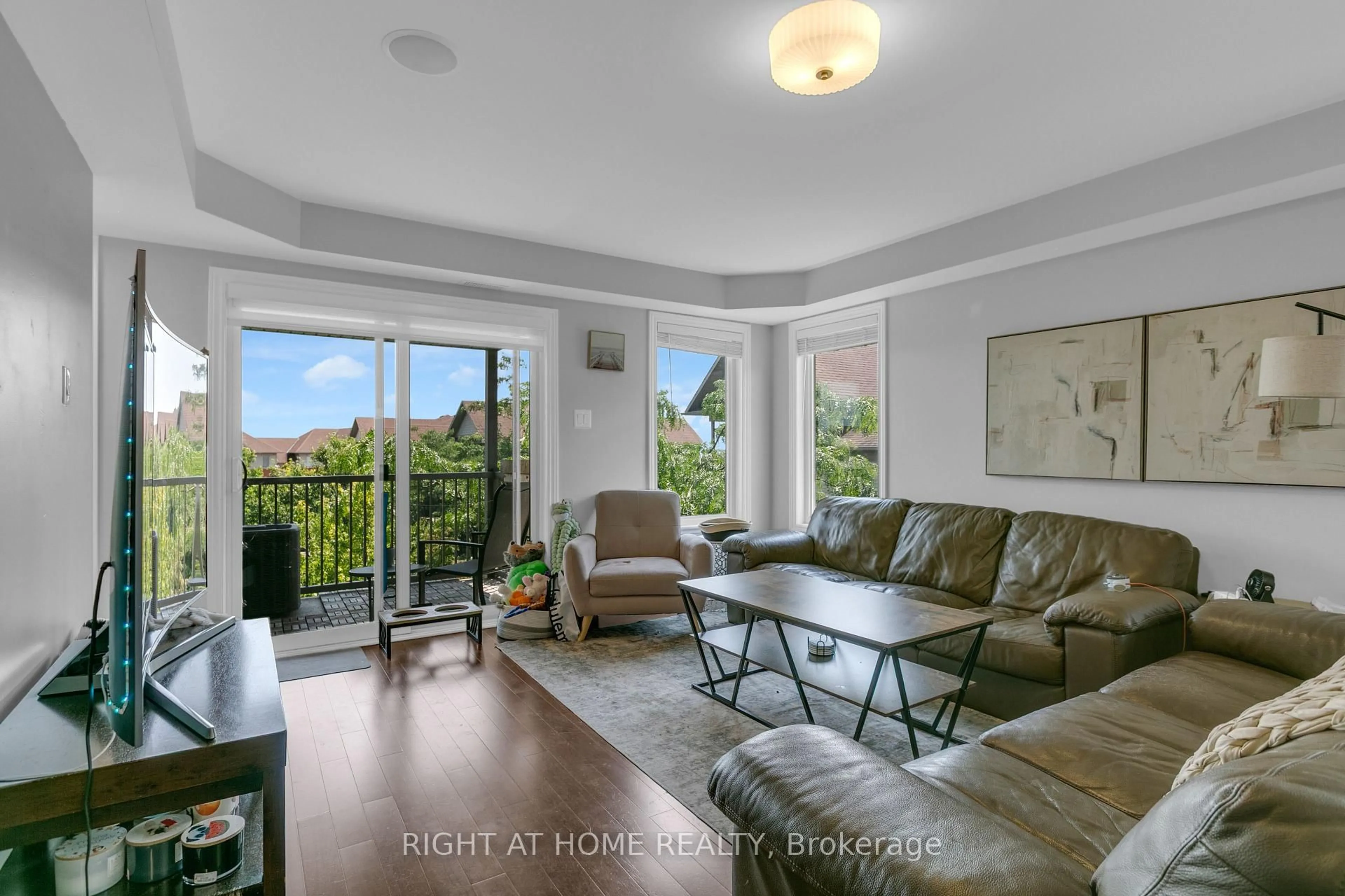 Living room with furniture, unknown for 585 Stonefield Private #8, Ottawa Ontario K2G 4R4