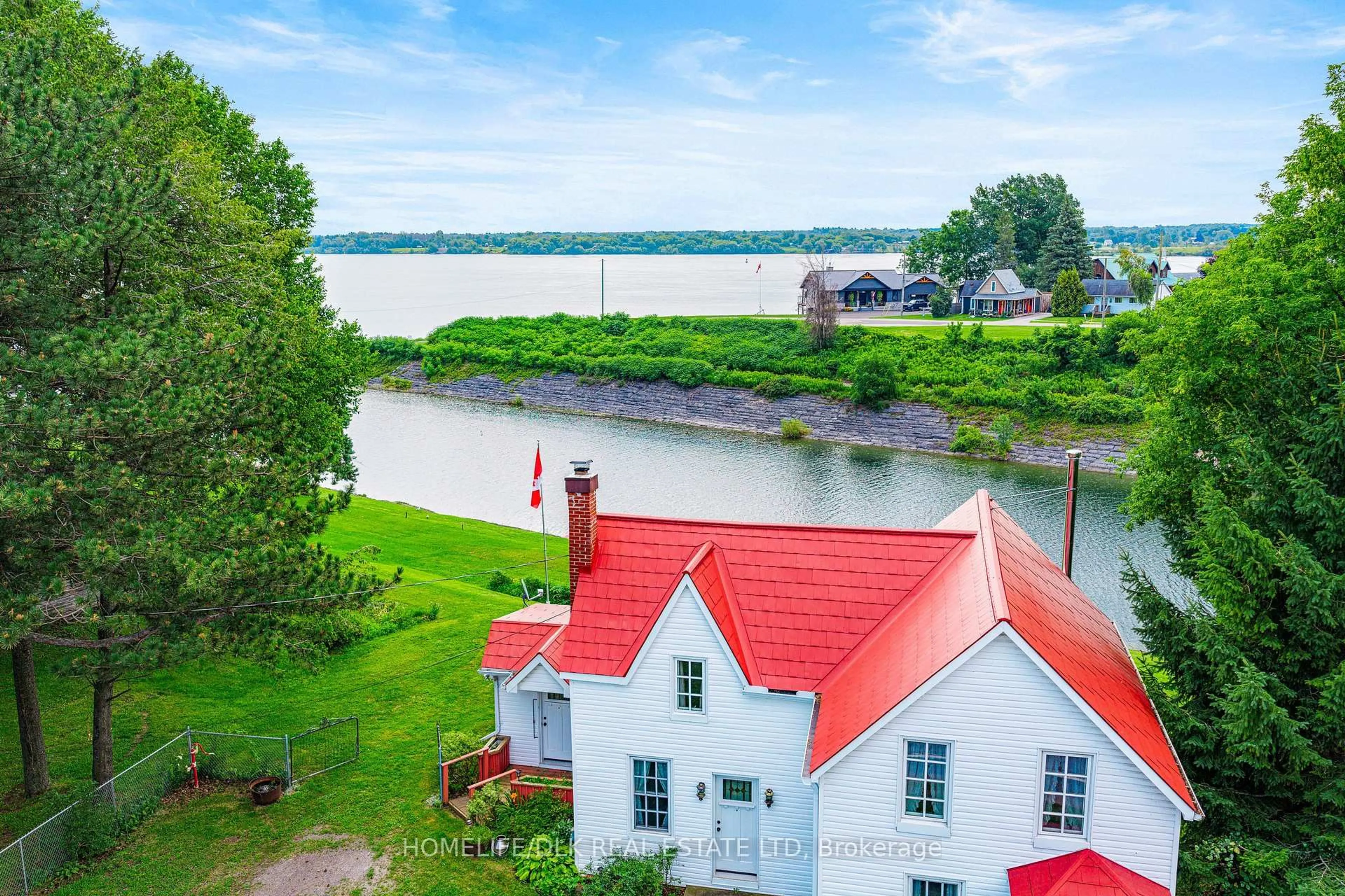 A pic from outside/outdoor area/front of a property/back of a property/a pic from drone, water/lake/river/ocean view for 415 2 Highway, Edwardsburgh/Cardinal Ontario K0E 1E0