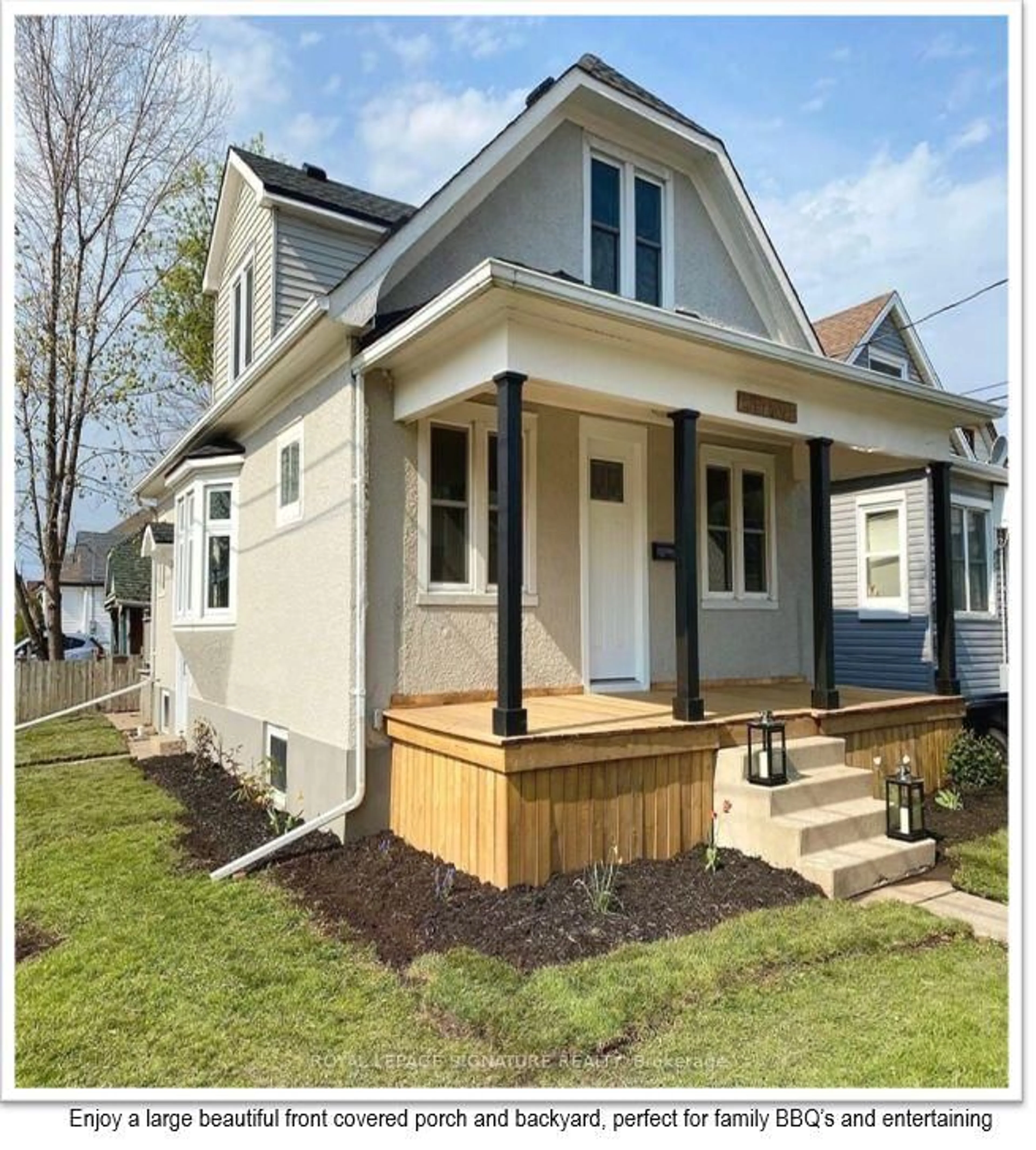 Home with vinyl exterior material, street for 13 Delaware St, St. Catharines Ontario L5M 5L9