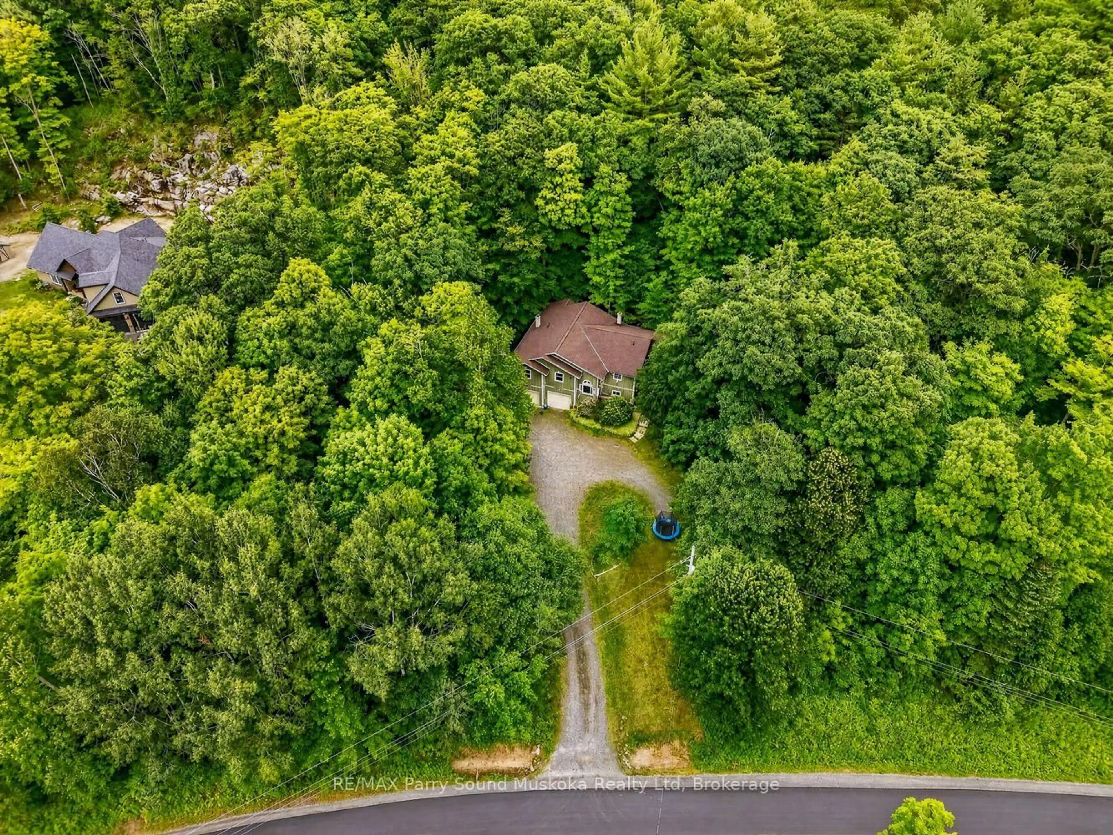 A pic from outside/outdoor area/front of a property/back of a property/a pic from drone, forest/trees view for 8 Mountain Basin Dr, McDougall Ontario P2A 2W9