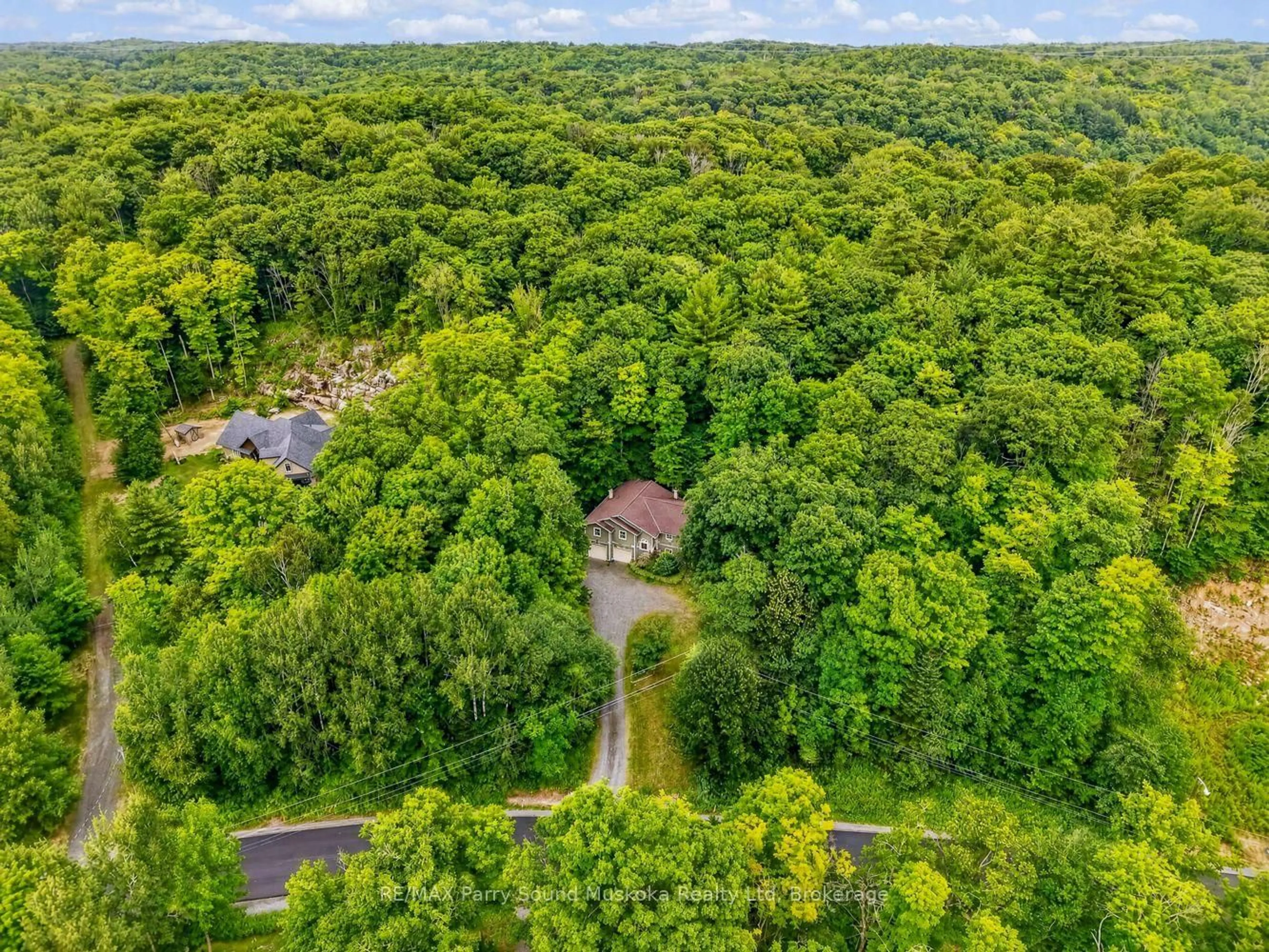 A pic from outside/outdoor area/front of a property/back of a property/a pic from drone, forest/trees view for 8 Mountain Basin Dr, McDougall Ontario P2A 2W9