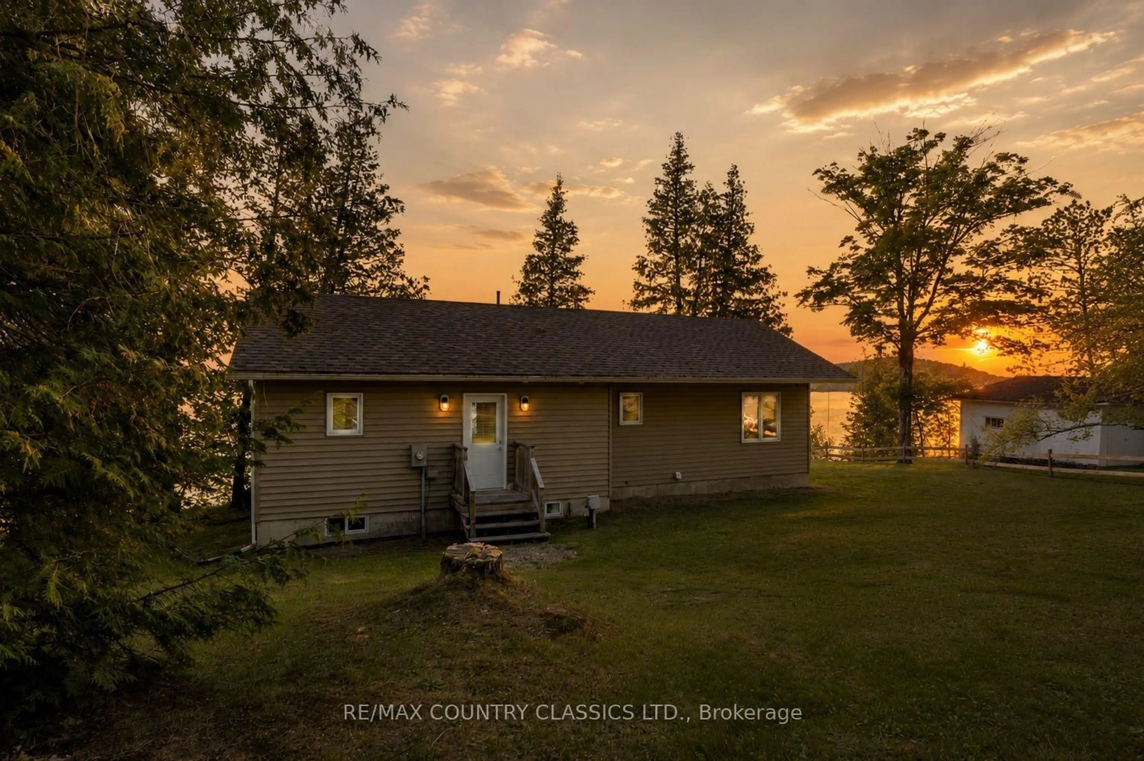 A pic from outside/outdoor area/front of a property/back of a property/a pic from drone, water/lake/river/ocean view for 27241 Highway 28, Highlands East Ontario K0L 1M0