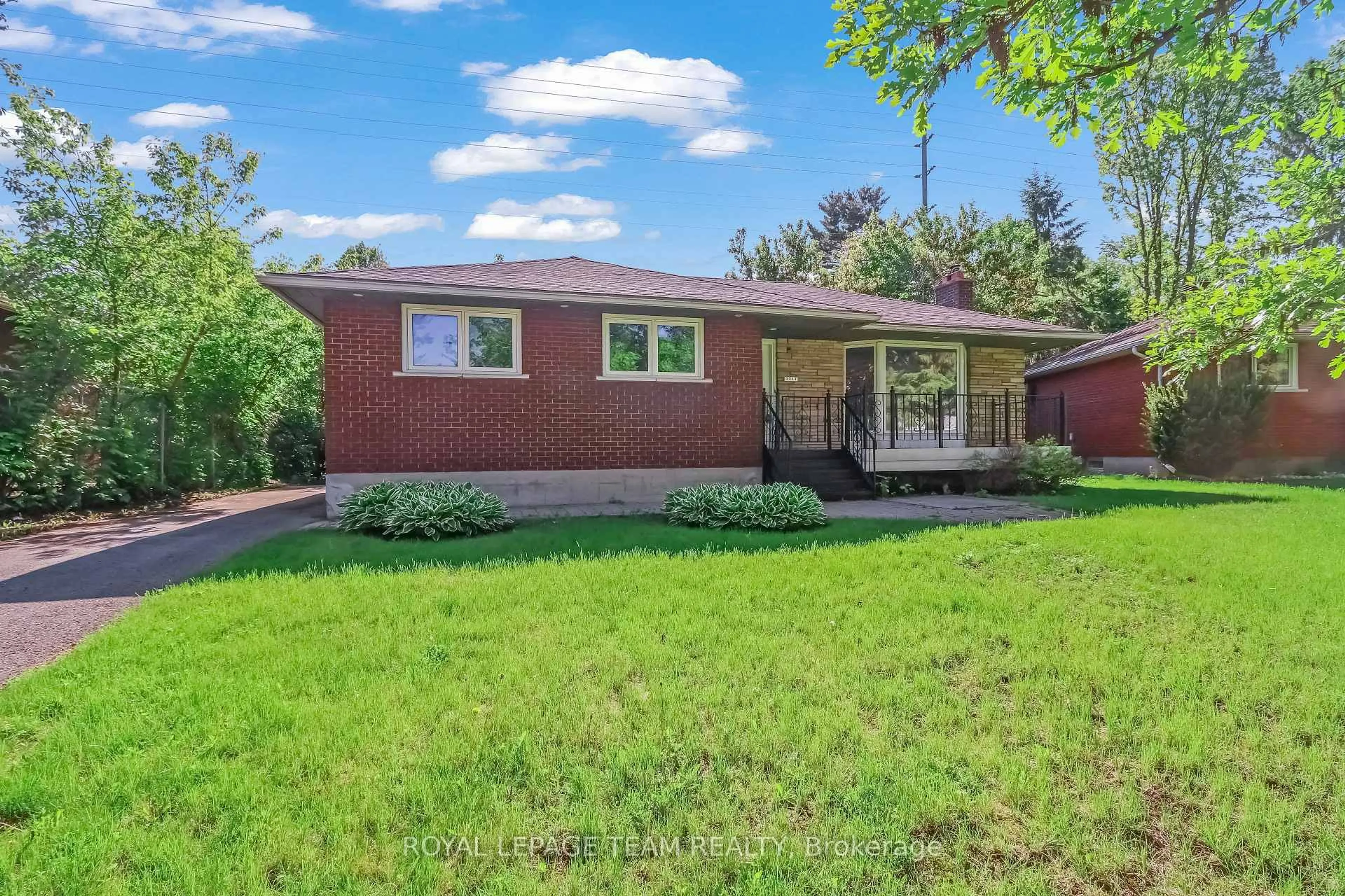 Home with brick exterior material, street for 2317 Elmira Dr, Ottawa Ontario K2C 1H3