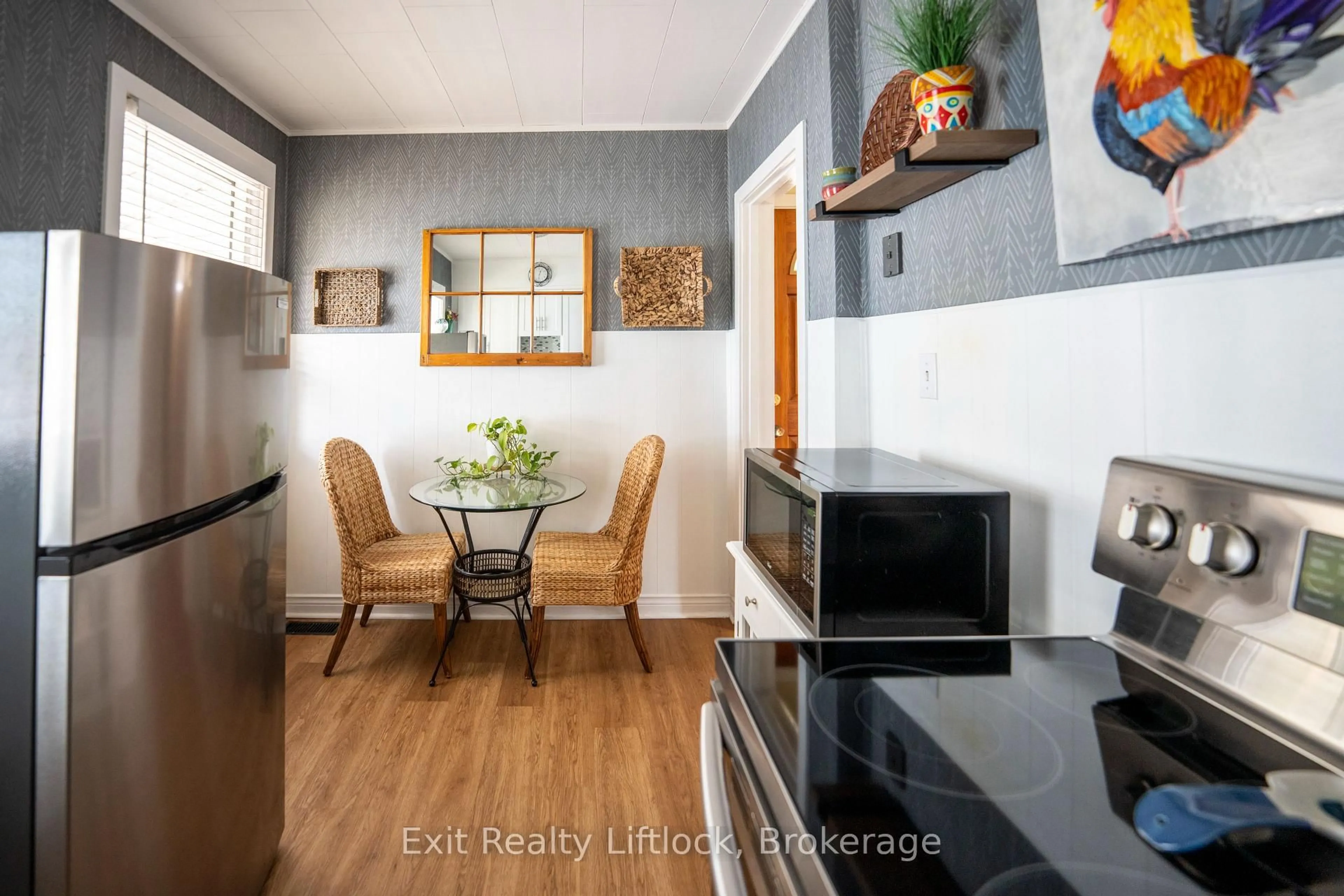 Open concept kitchen, wood/laminate floor for 521 Mckellar St, Peterborough Ontario K9J 1R1