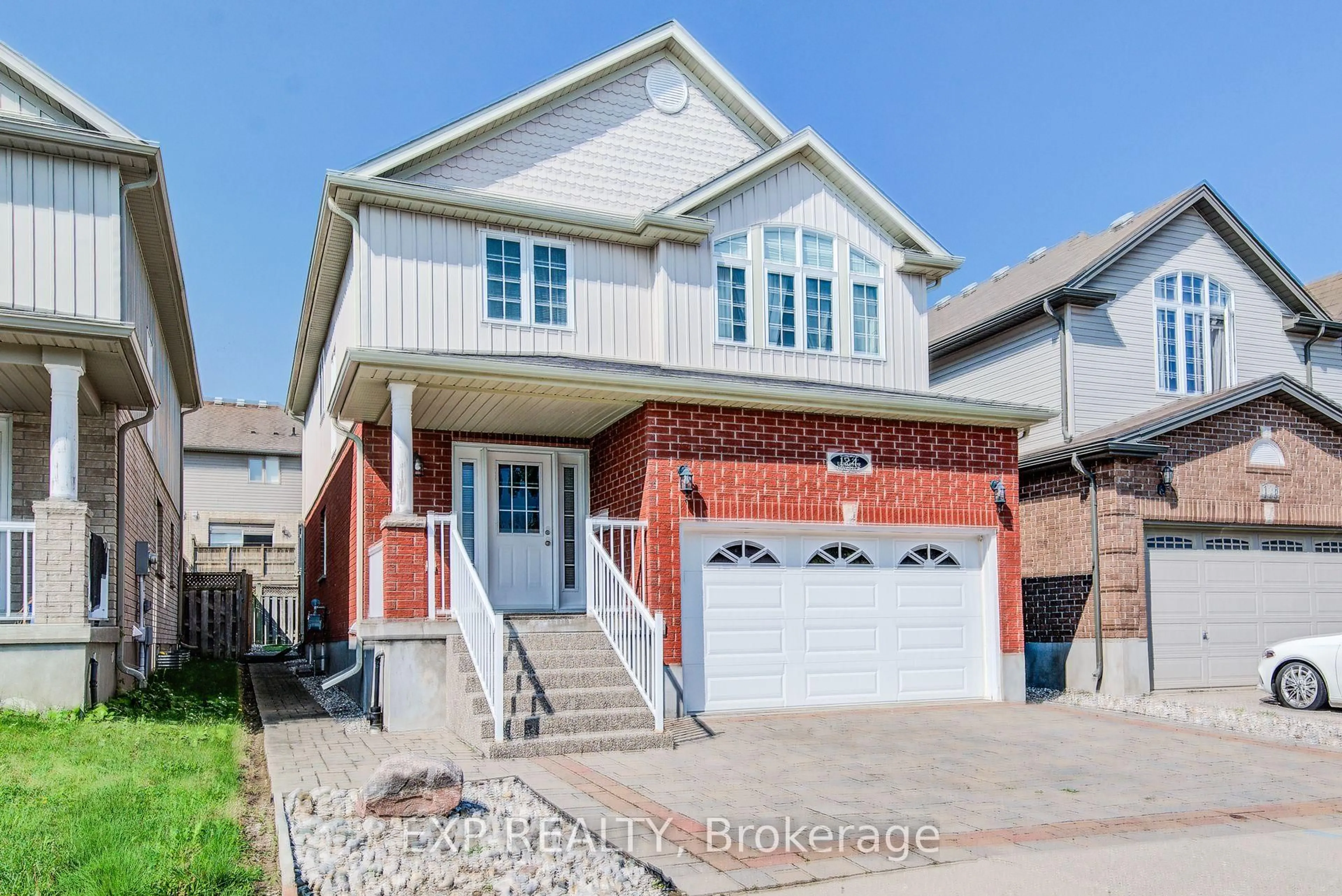 Home with brick exterior material, street for 124 Udvari Cres, Kitchener Ontario N2N 3P6