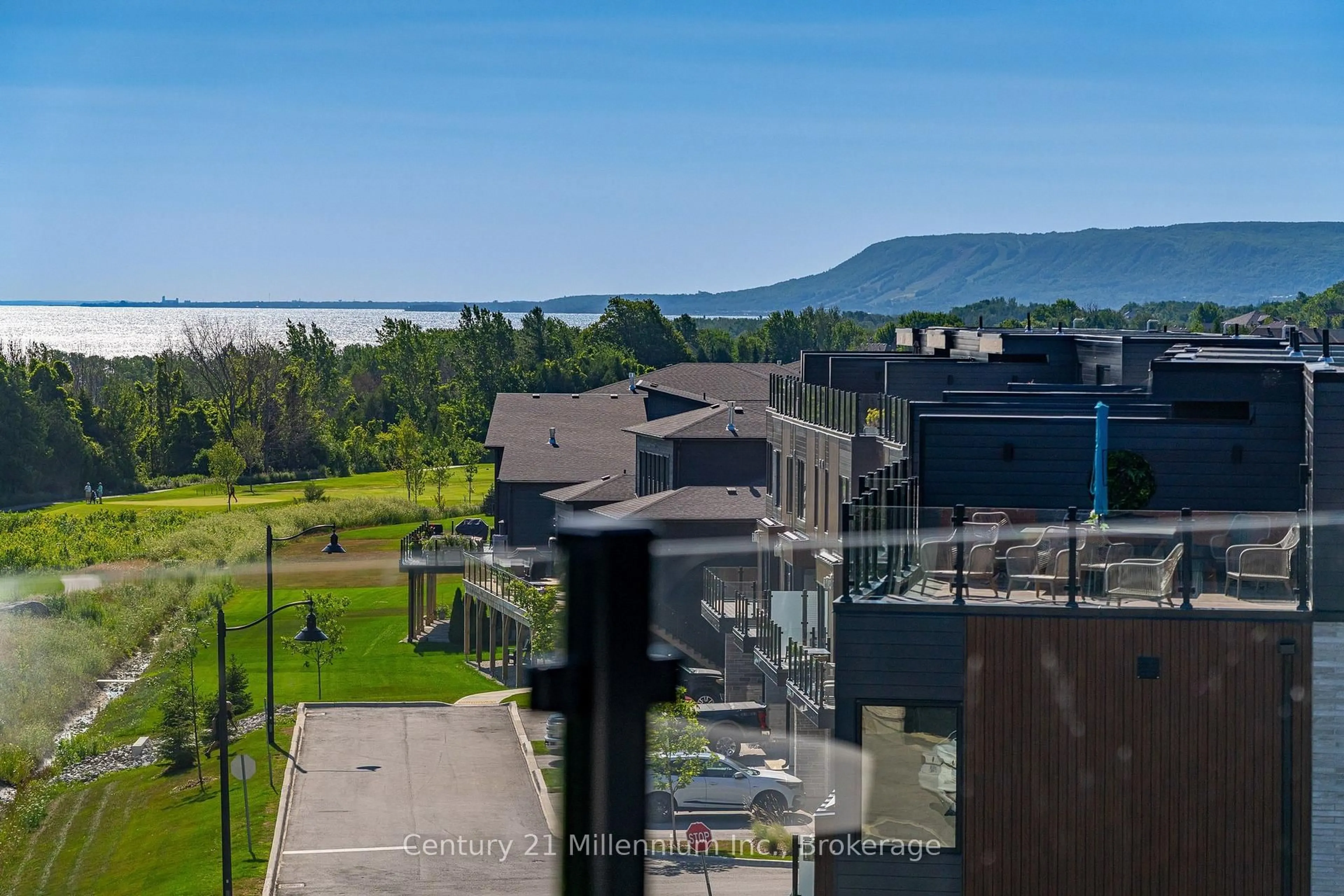 A pic from outside/outdoor area/front of a property/back of a property/a pic from drone, mountain view for 117 Sladden Crt ## 22, Blue Mountains Ontario N0H 2P0