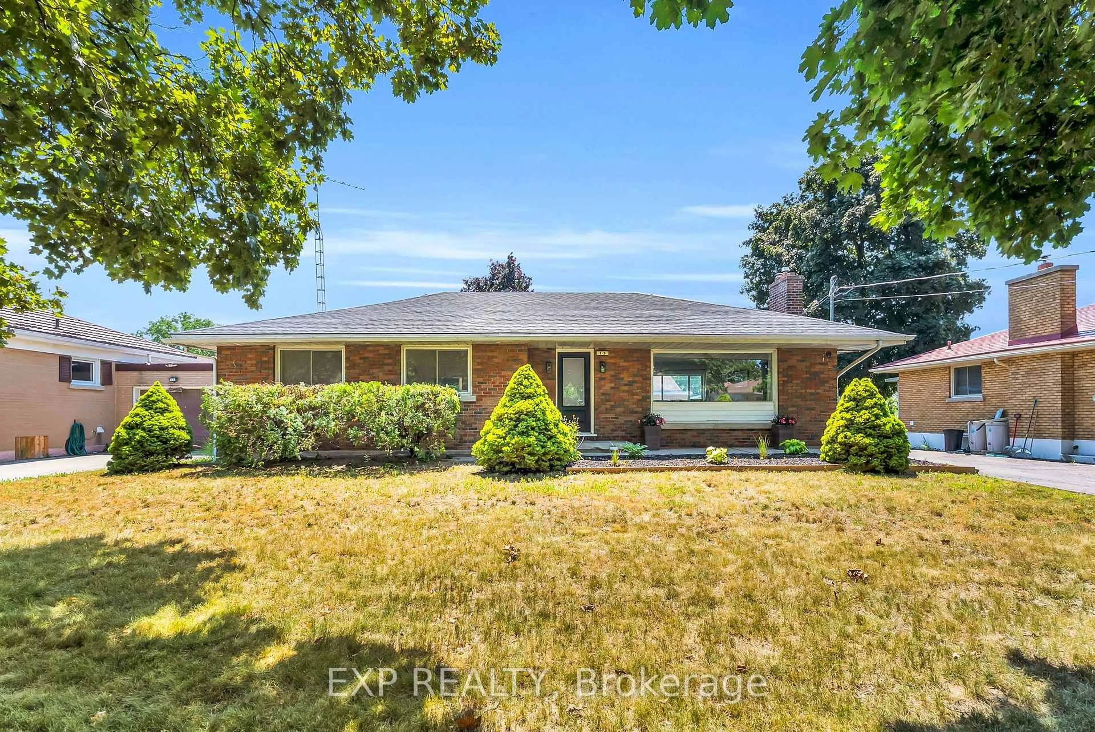 Home with brick exterior material, street for 19 Woodman Dr, Brantford Ontario N3S 4K2