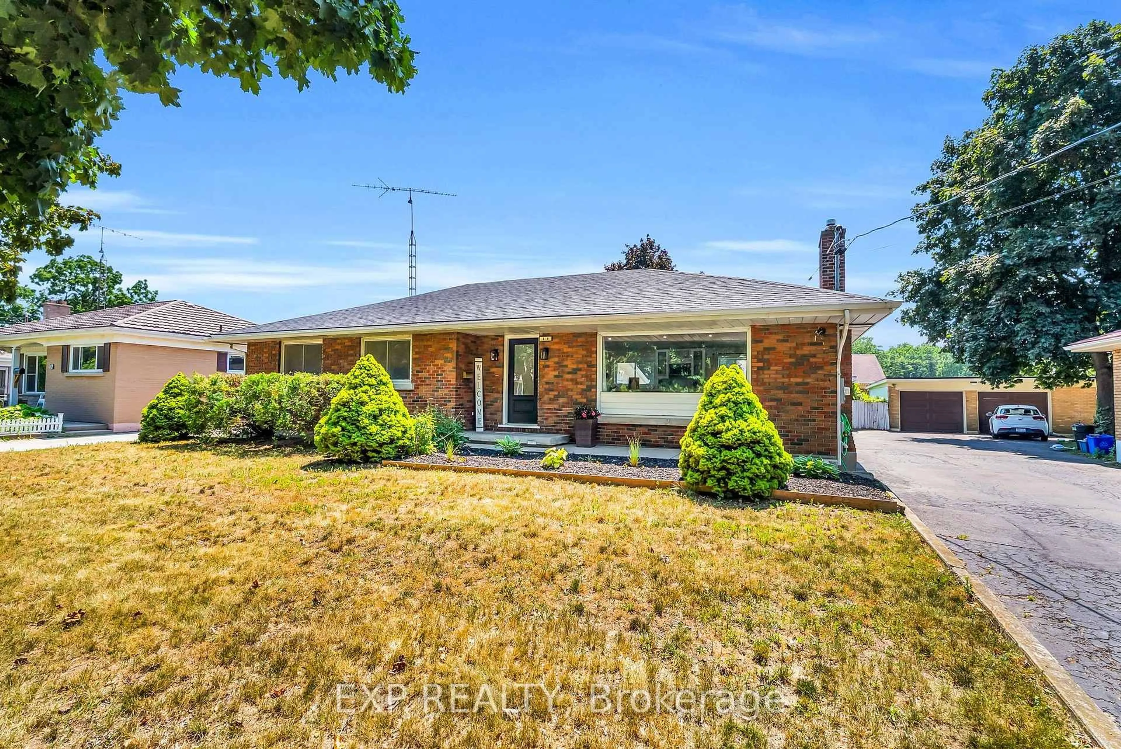 Home with brick exterior material, street for 19 Woodman Dr, Brantford Ontario N3S 4K2