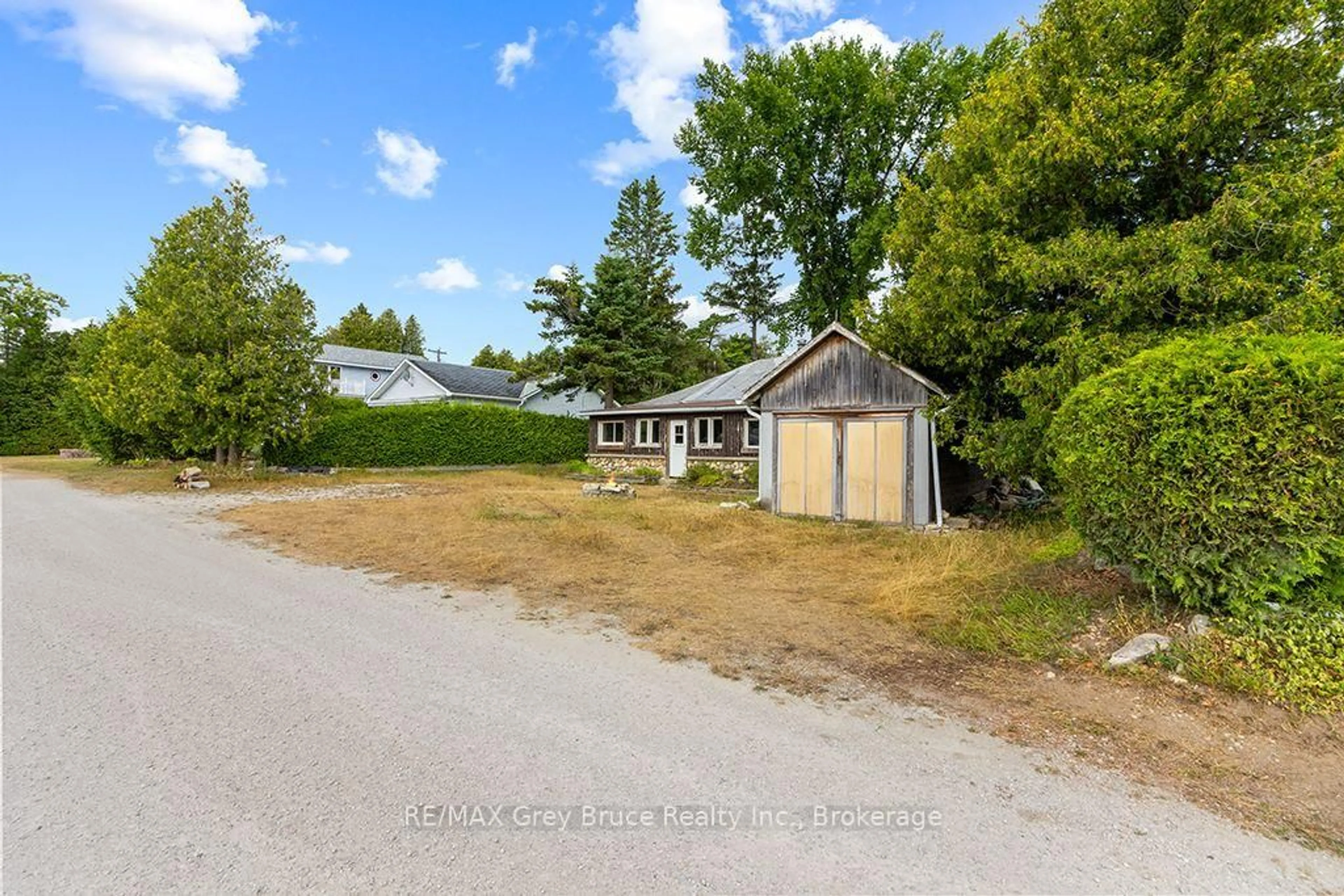 A pic from outside/outdoor area/front of a property/back of a property/a pic from drone, unknown for 11 McNeil St, Northern Bruce Peninsula Ontario N0H 1W0
