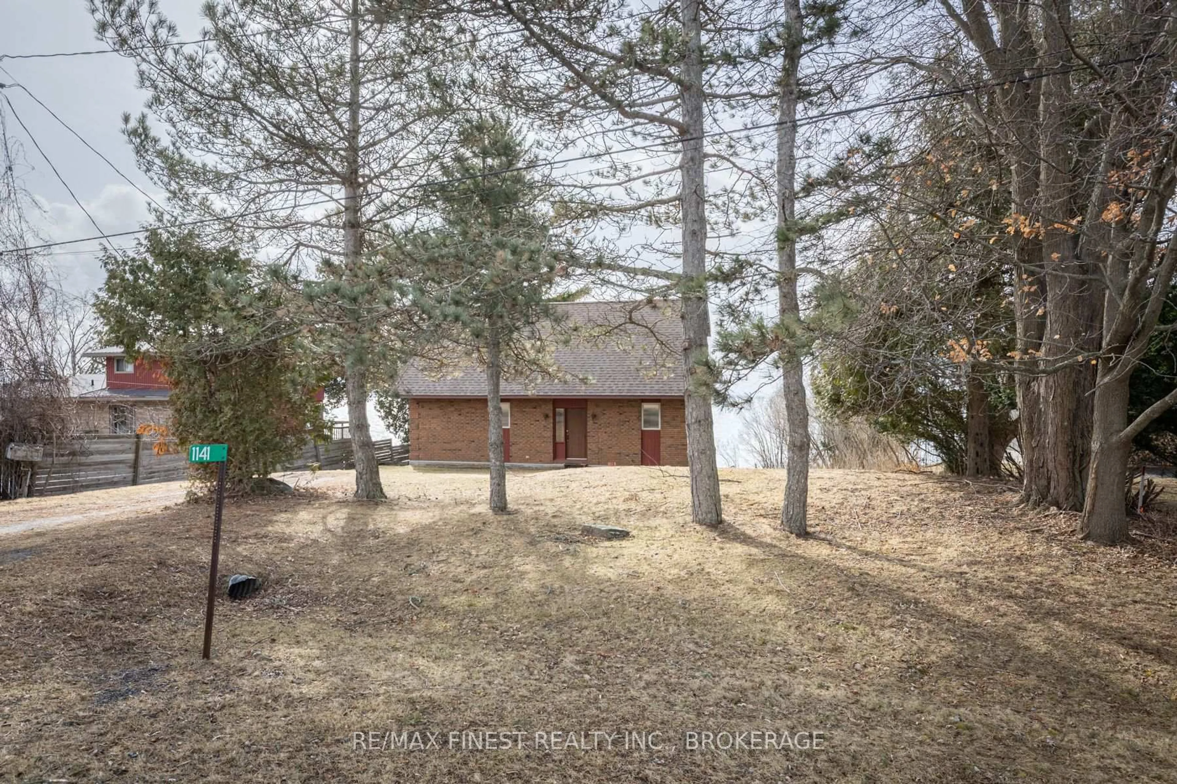 A pic from outside/outdoor area/front of a property/back of a property/a pic from drone, forest/trees view for 1141 Front Rd, Kingston Ontario K7M 4M2