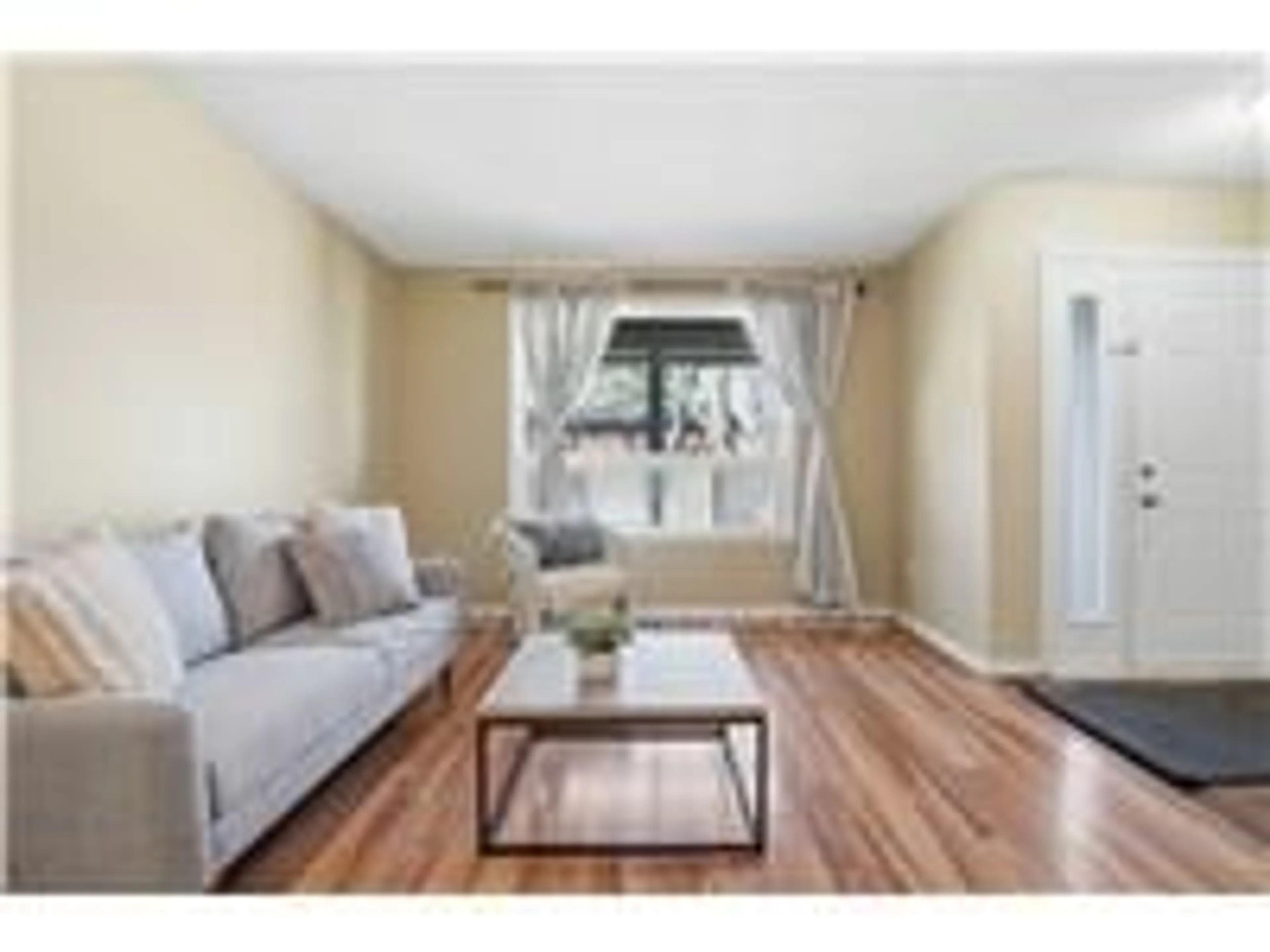 Living room with furniture, wood/laminate floor for 94 WENDOVER Dr, Hamilton Ontario L9C 5X5