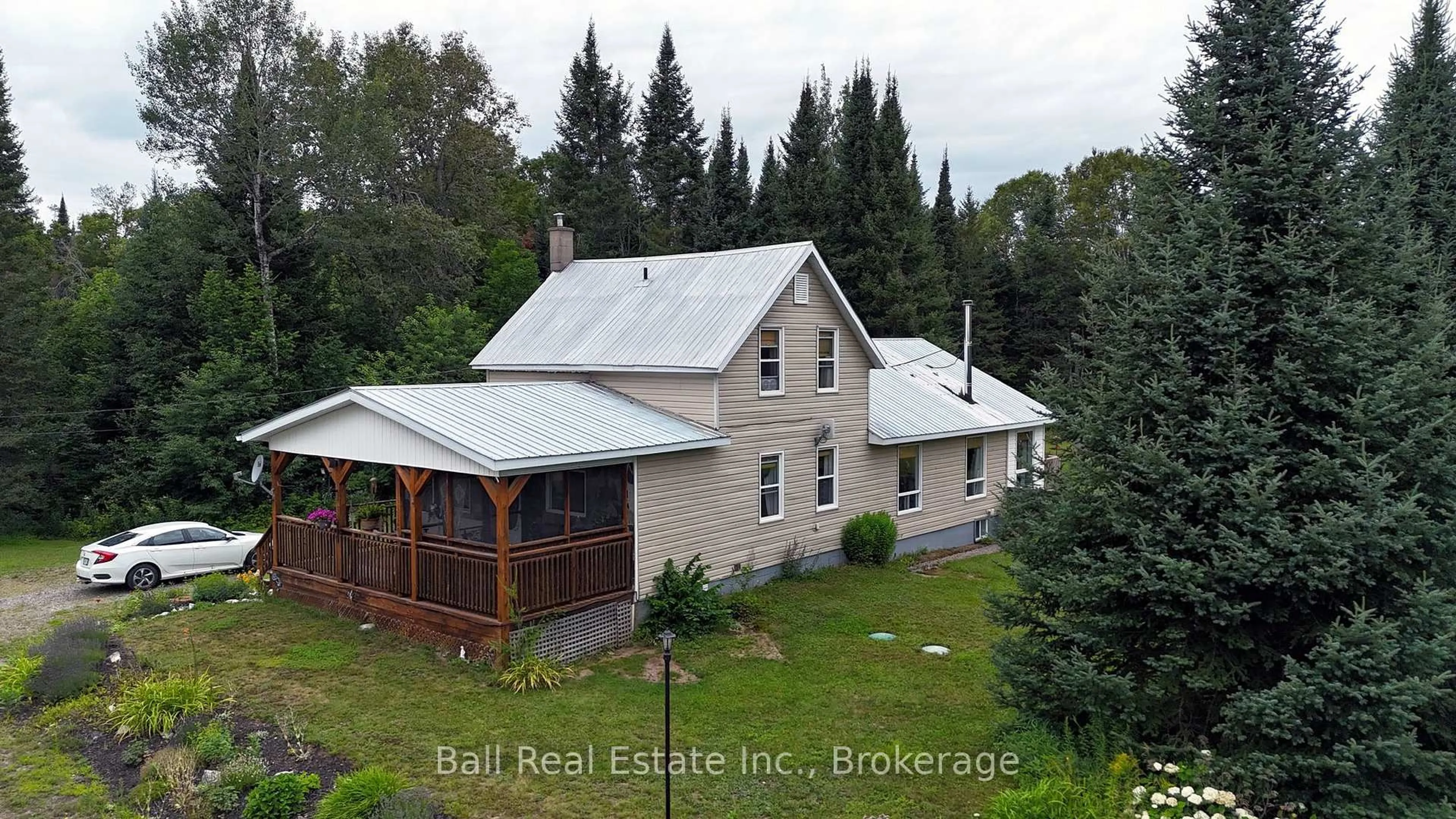 A pic from outside/outdoor area/front of a property/back of a property/a pic from drone, building for 19573 Highway #118 Highway, Highlands East Ontario K0L 3C0