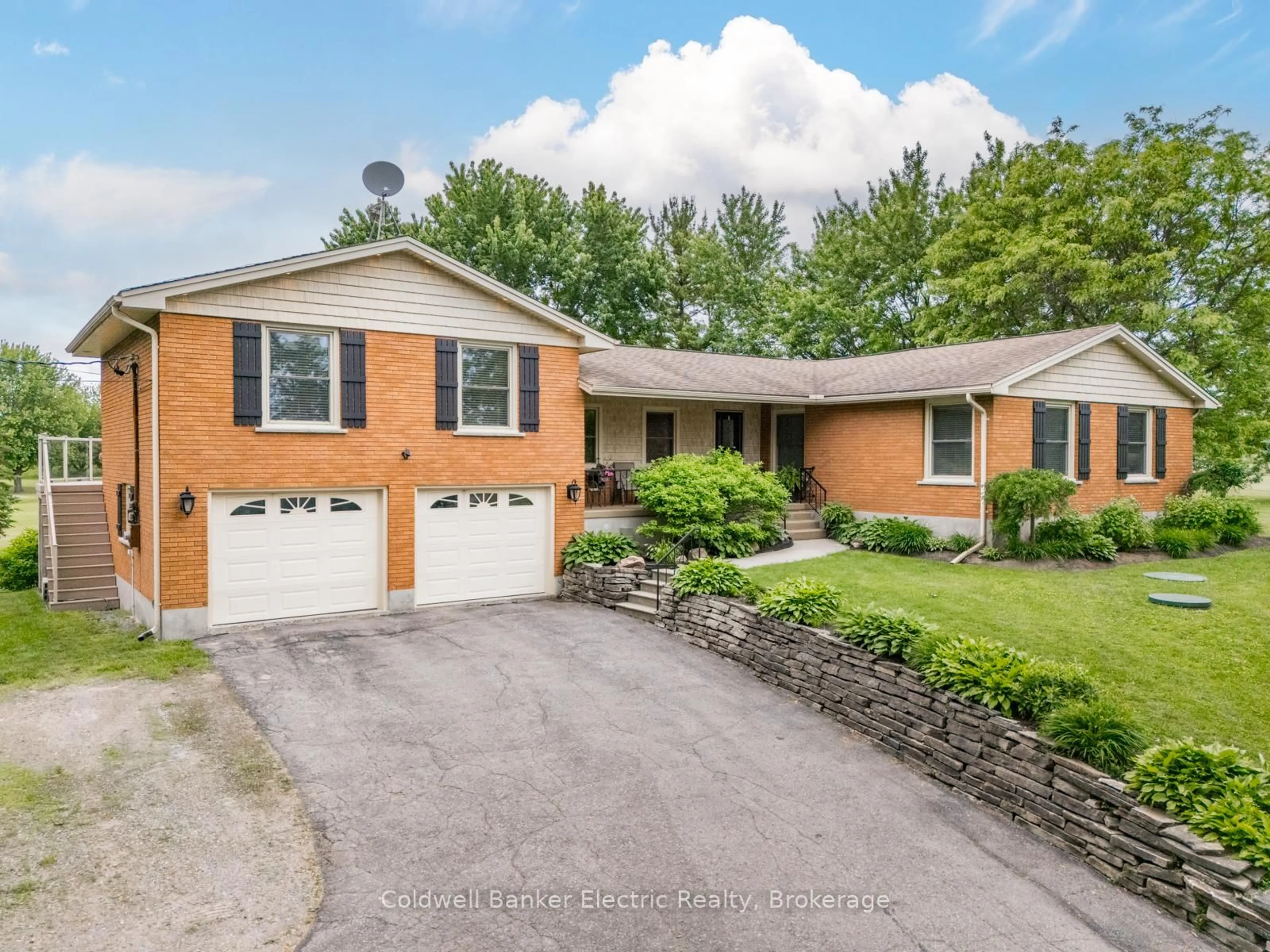 Home with brick exterior material, street for 2367 Base Line, Otonabee-South Monaghan Ontario K9J 6X9