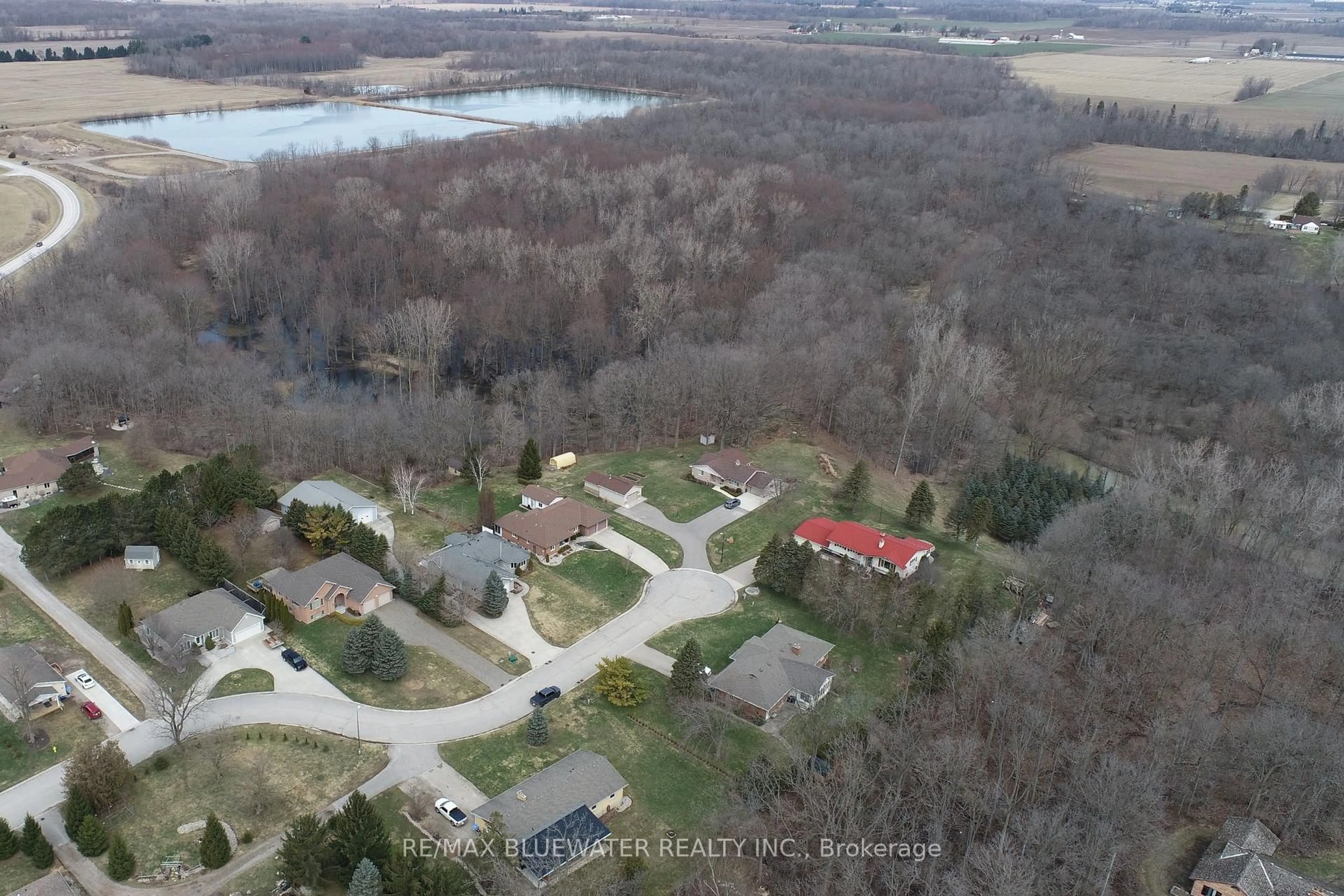 A pic from outside/outdoor area/front of a property/back of a property/a pic from drone, water/lake/river/ocean view for 365 Station St, North Middlesex Ontario N0M 2K0