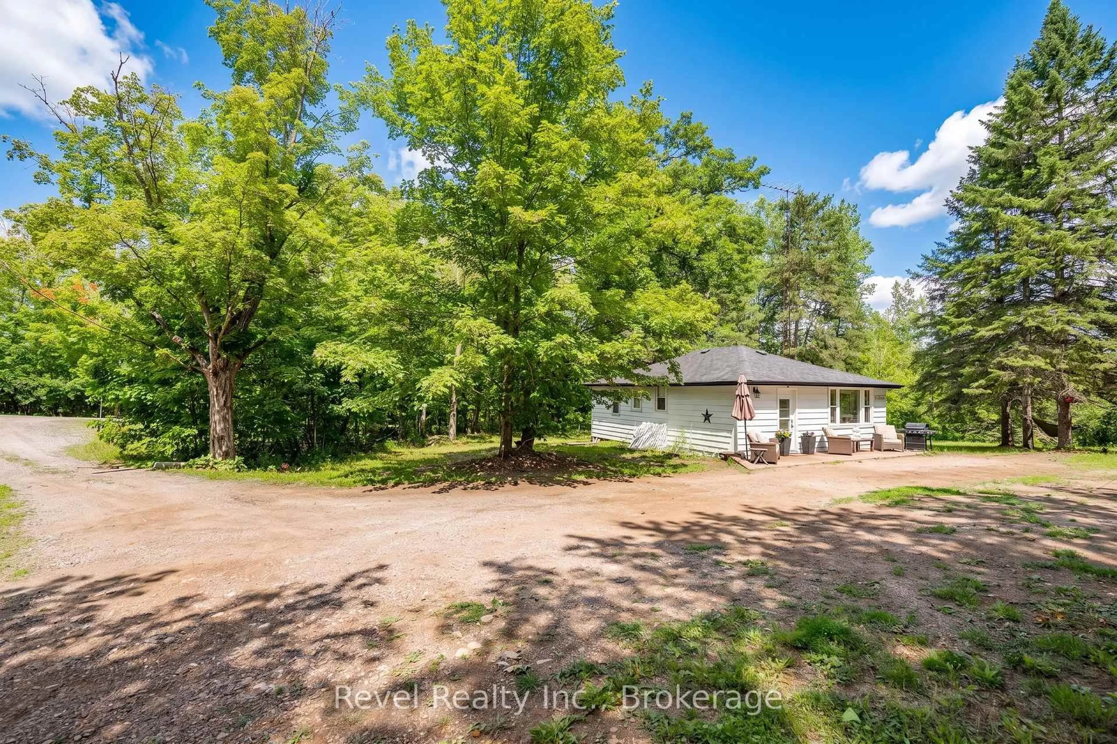 A pic from outside/outdoor area/front of a property/back of a property/a pic from drone, forest/trees view for 4 Gypsy Point Rd, Trent Lakes Ontario K0M 1A0