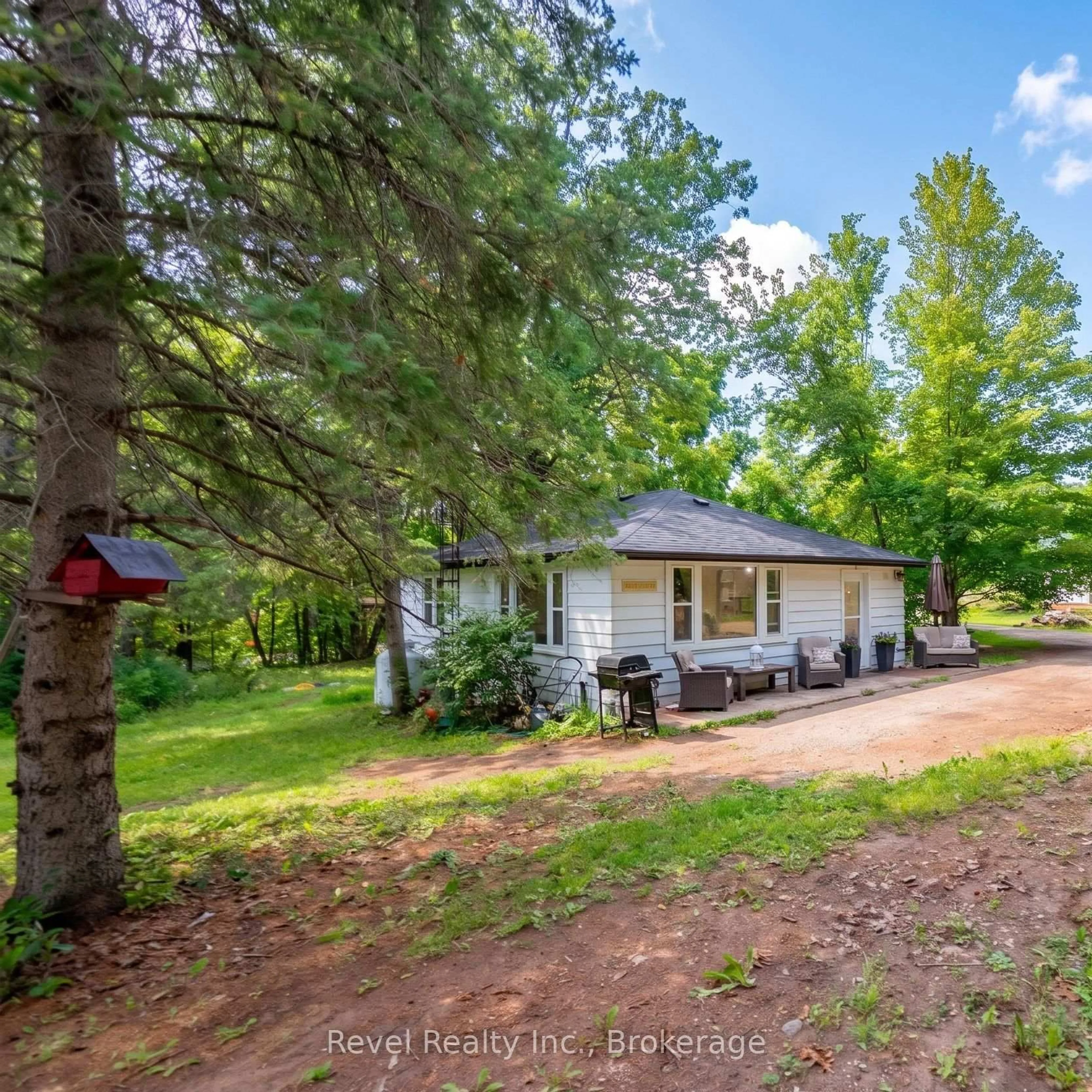 A pic from outside/outdoor area/front of a property/back of a property/a pic from drone, forest/trees view for 4 Gypsy Point Rd, Trent Lakes Ontario K0M 1A0