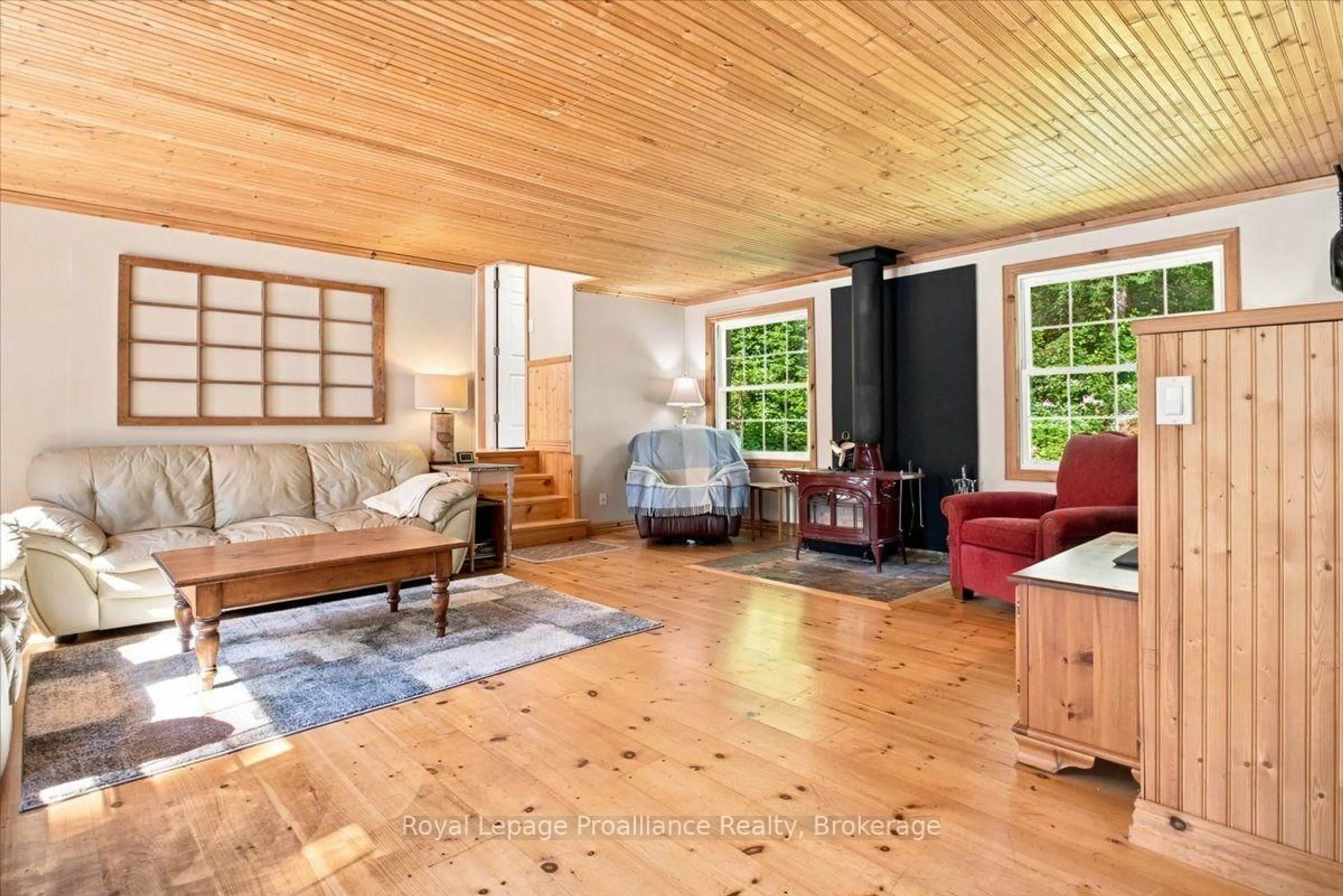Living room with furniture, wood/laminate floor for 146 Skootamatta Lake, Cloyne Ontario K0H 1K0