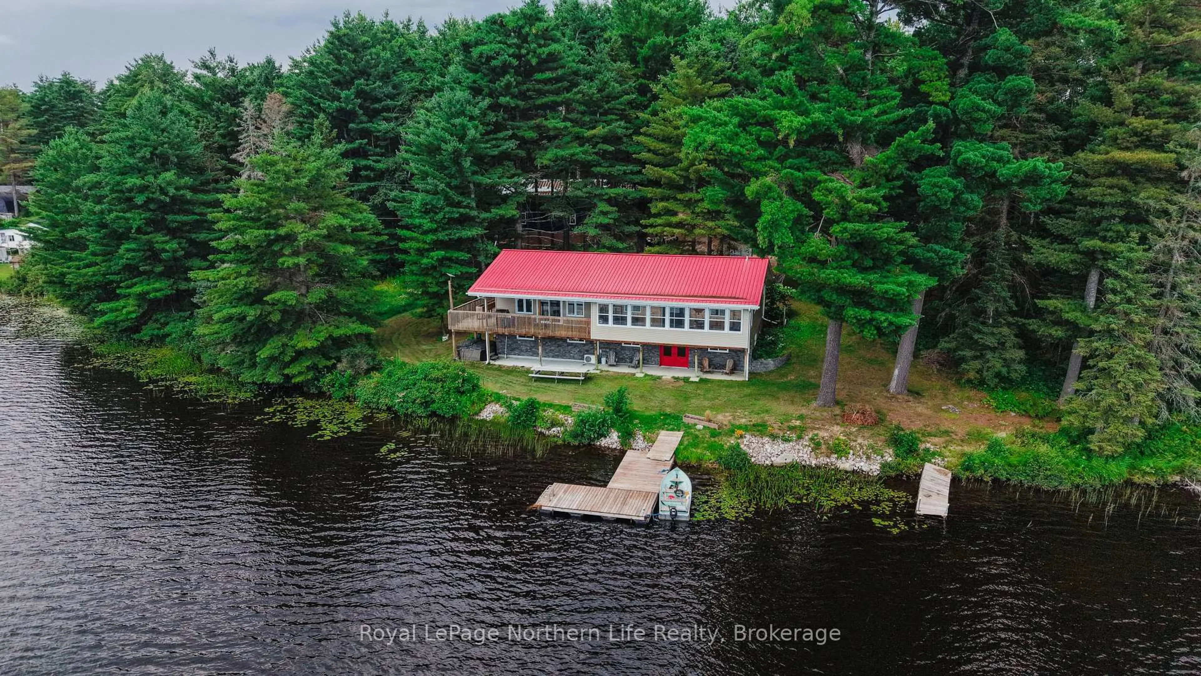 A pic from outside/outdoor area/front of a property/back of a property/a pic from drone, water/lake/river/ocean view for 33 G Lac Cache Rd, West Nipissing Ontario P0H 2M0