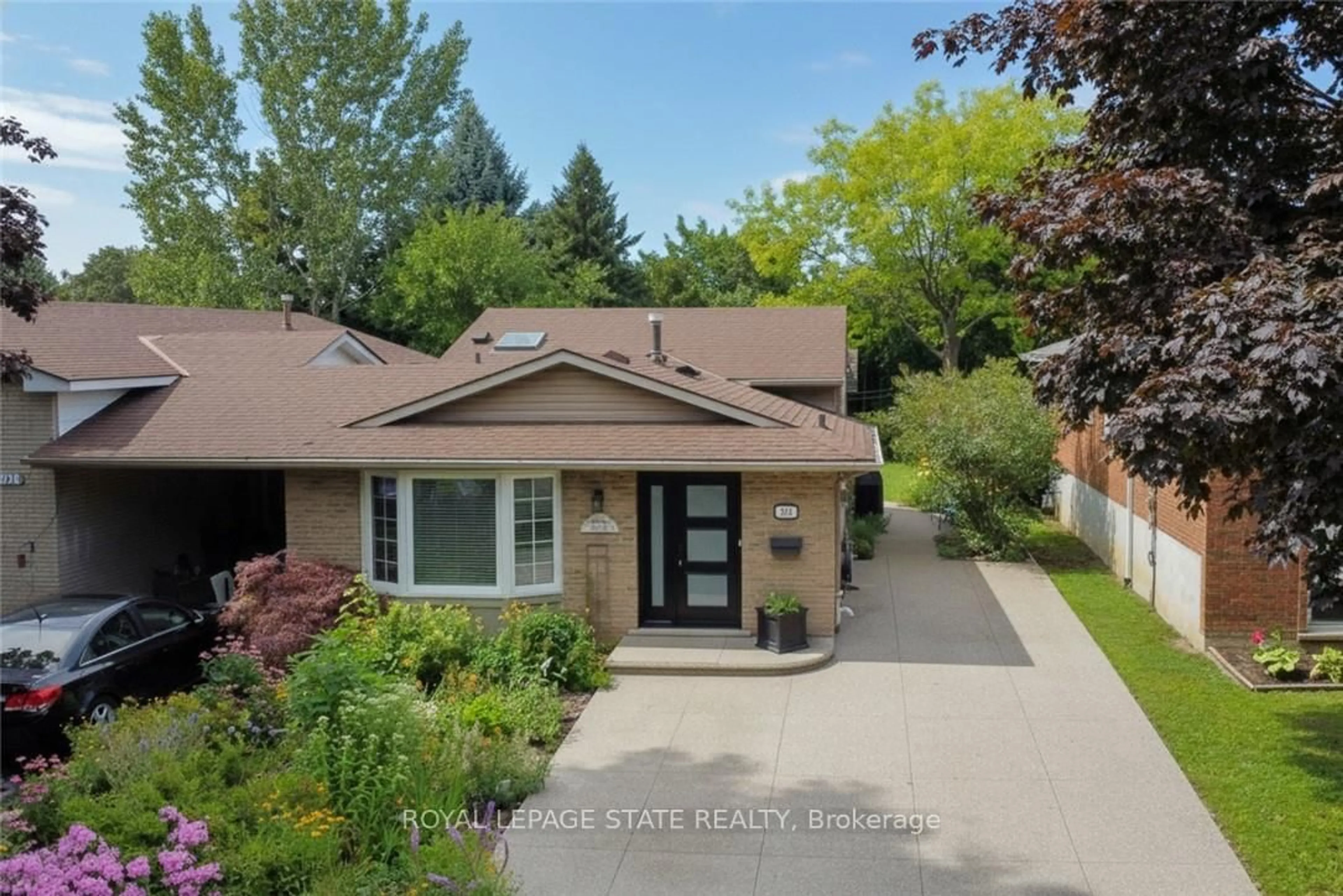 Home with brick exterior material, street for 374 Brigadoon Dr, Hamilton Ontario L9C 6X4