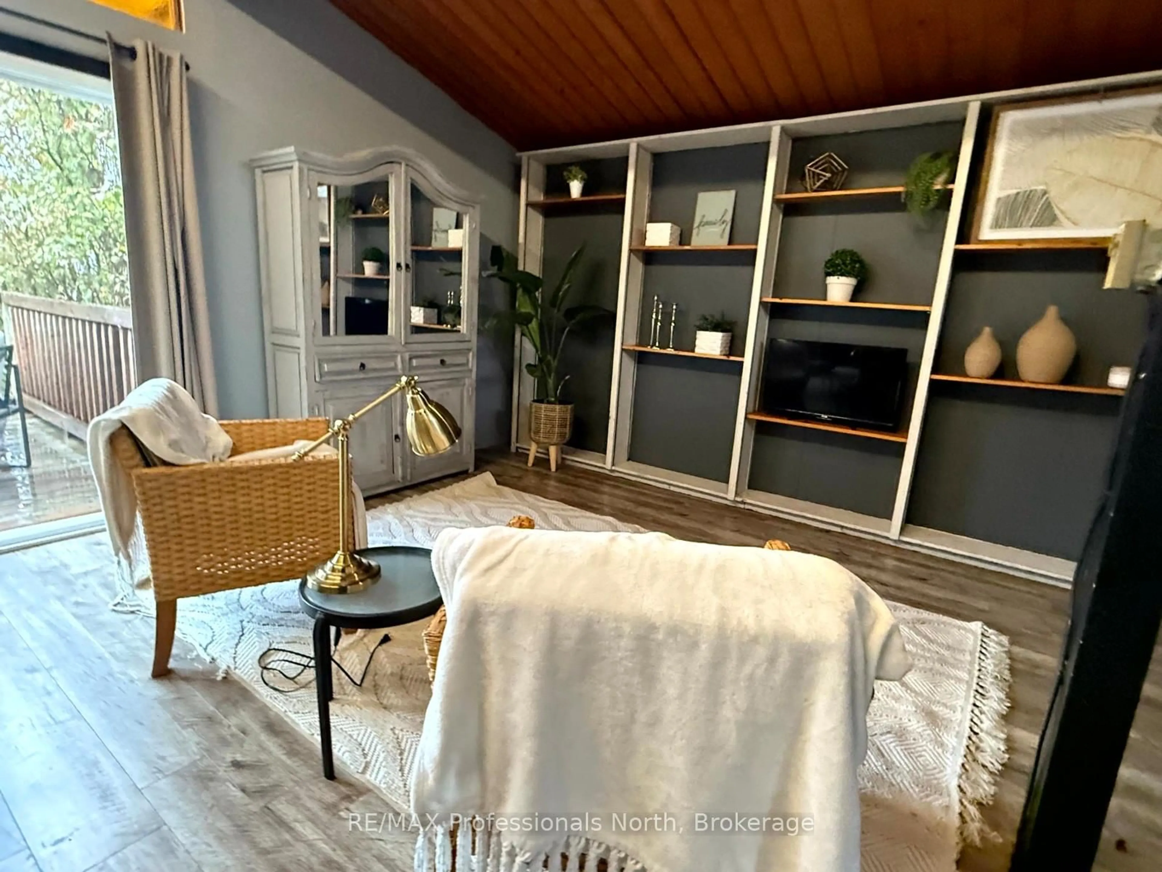 Living room with furniture, wood/laminate floor for 2307 Loop Rd, Highlands East Ontario K0L 3C0