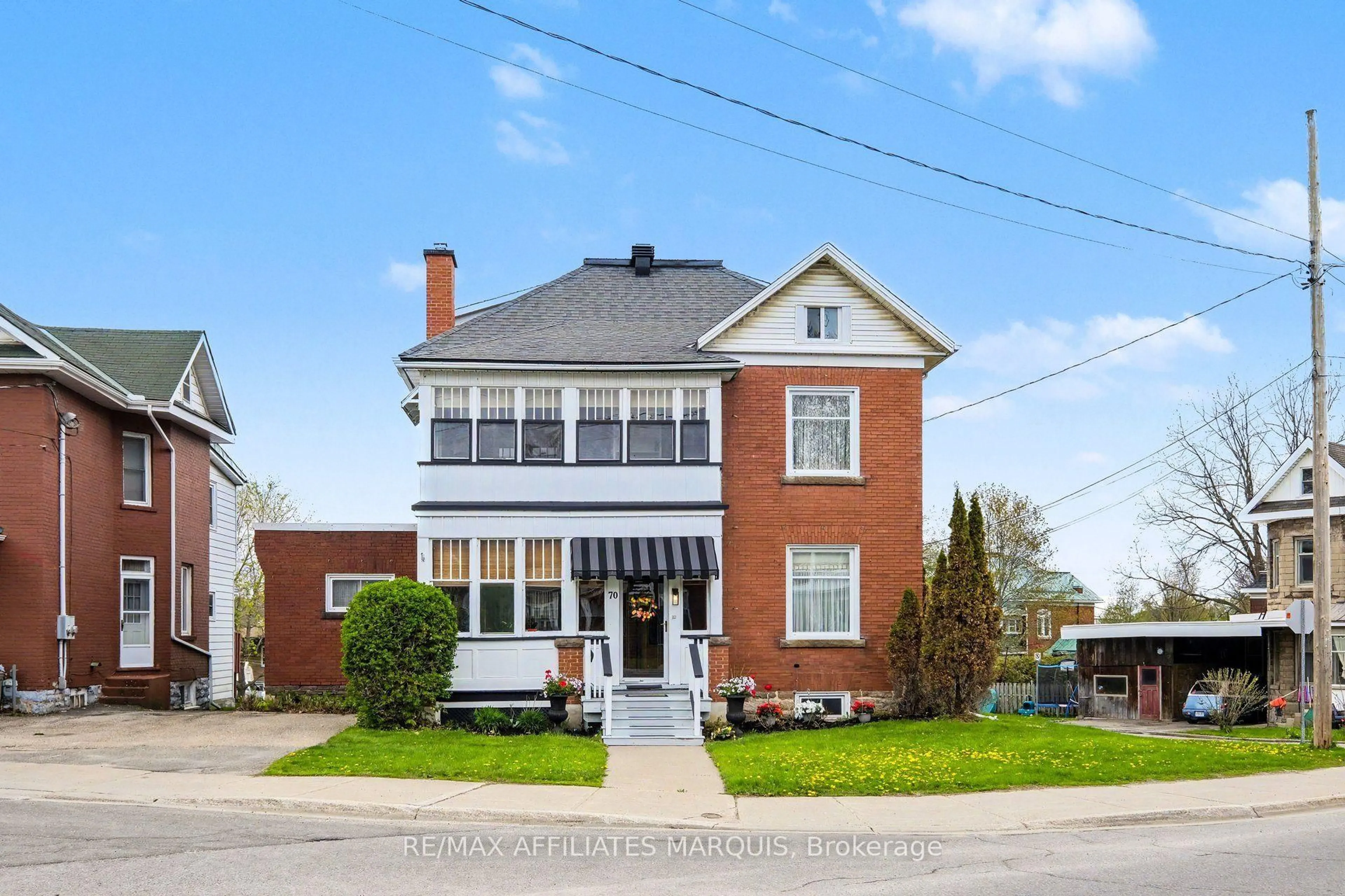 Home with brick exterior material, street for 70 Maple Ave, Smiths Falls Ontario K7A 2A7