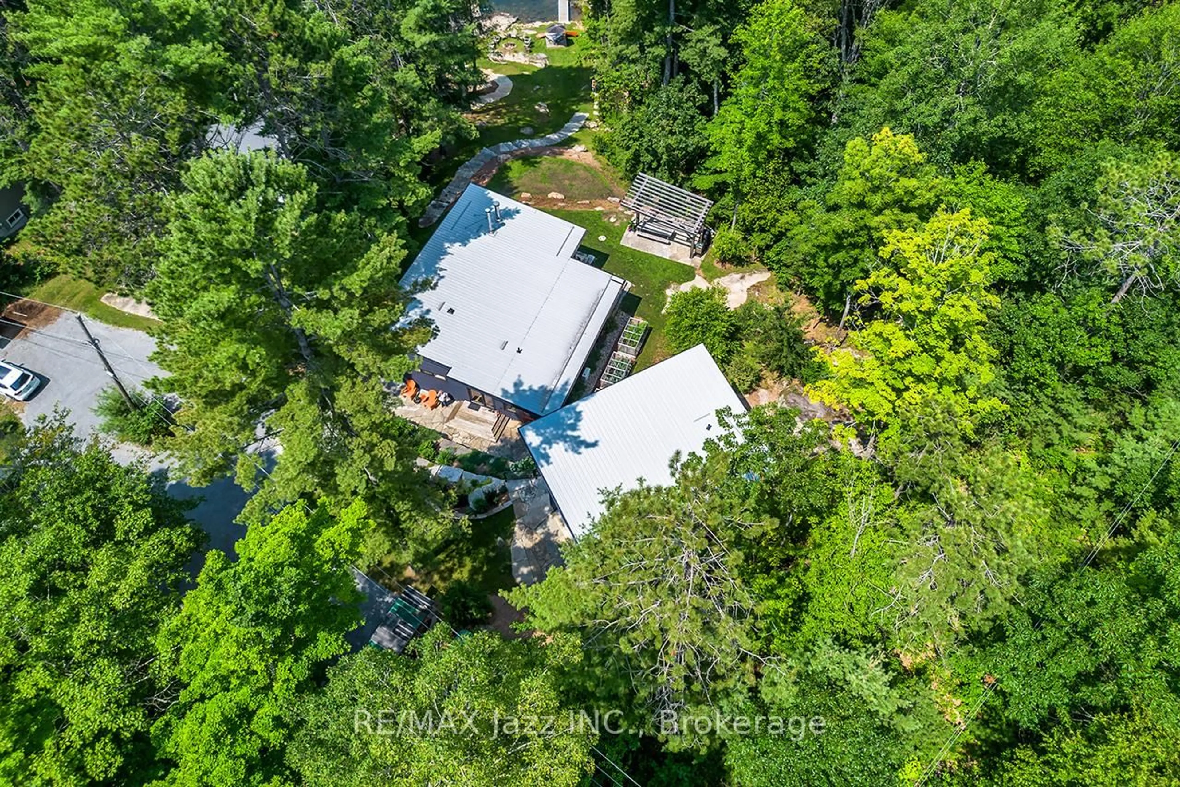 A pic from outside/outdoor area/front of a property/back of a property/a pic from drone, forest/trees view for 88 Brock Rd, North Kawartha Ontario K0L 1A0