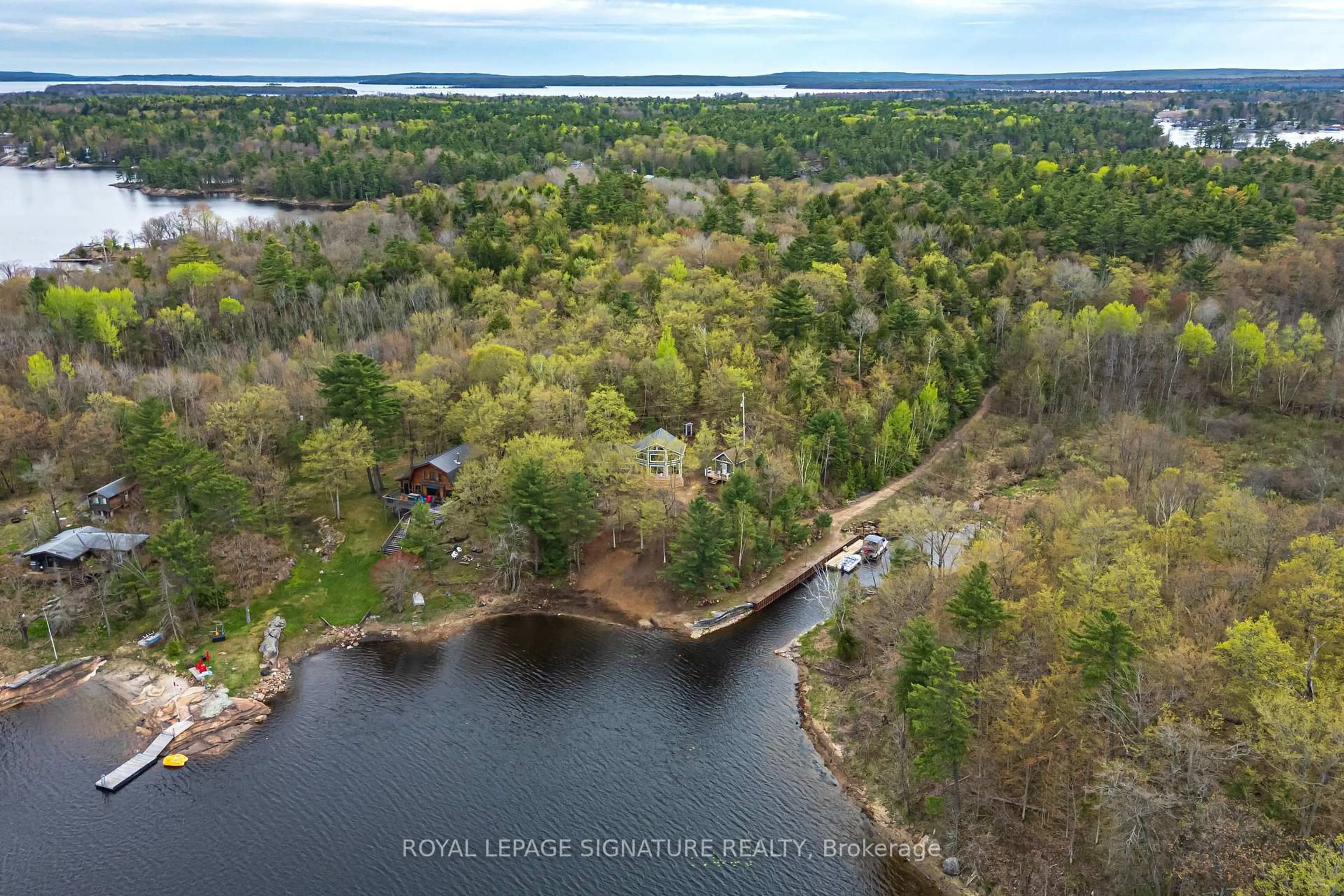 A pic from outside/outdoor area/front of a property/back of a property/a pic from drone, water/lake/river/ocean view for 9316 Georgian Bay Shore Rd, Georgian Bay Ontario P0E 1E0