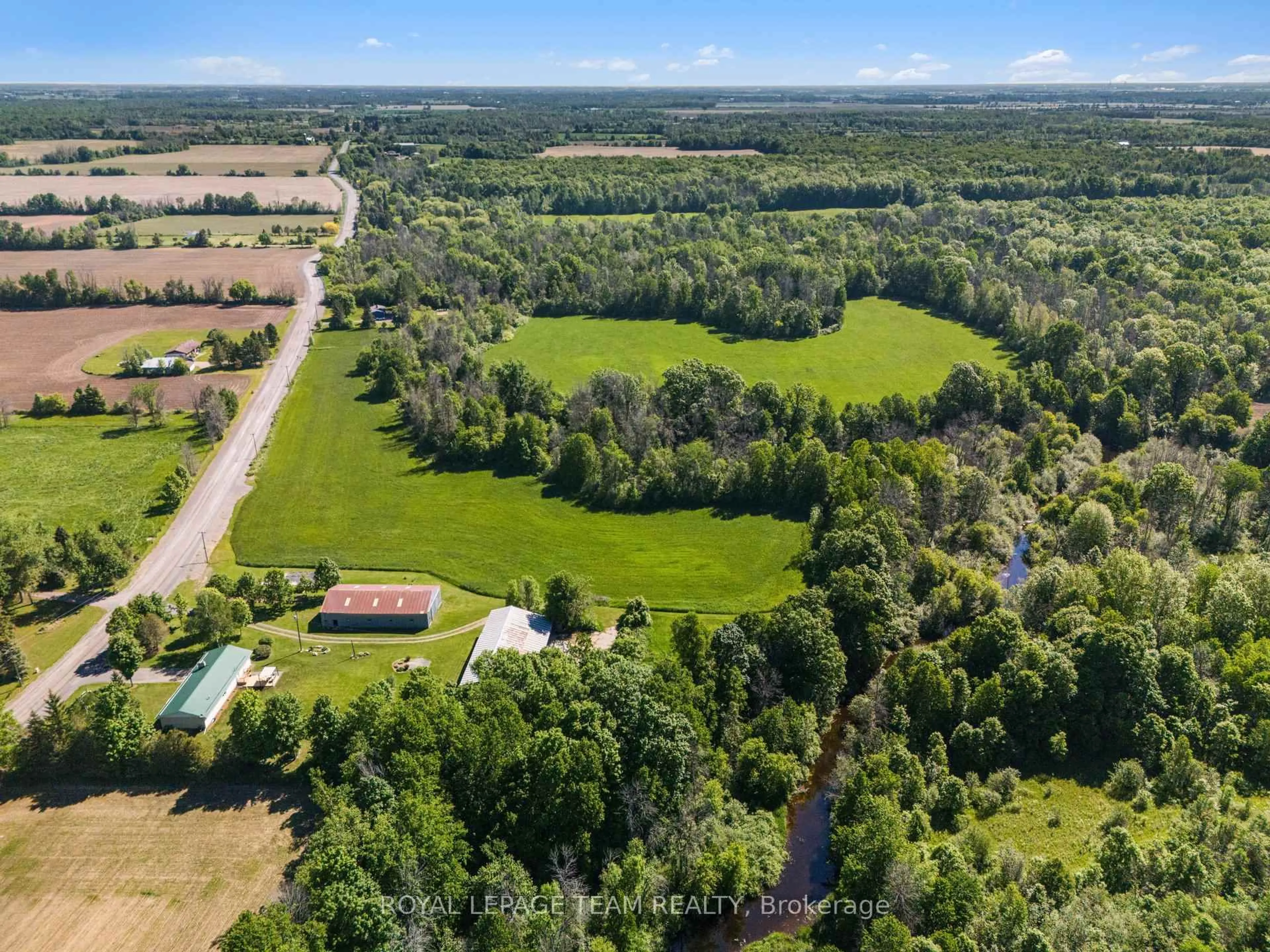 A pic from outside/outdoor area/front of a property/back of a property/a pic from drone, forest/trees view for 512 Edward Scott Rd, North Grenville Ontario K0G 1J0