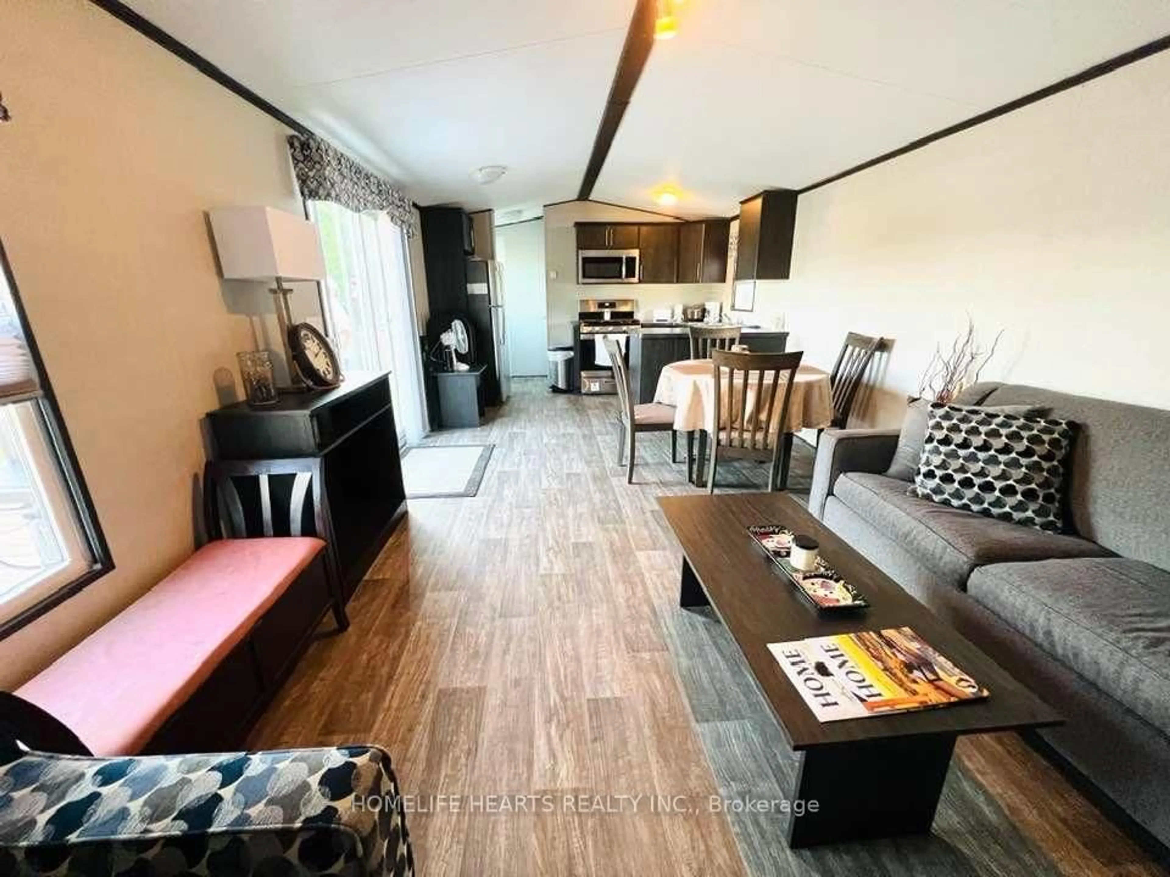 Living room with furniture, wood/laminate floor for 1235 Villiers Line 114 Forest Dr, Otonabee-South Monaghan Ontario K0L 2G0